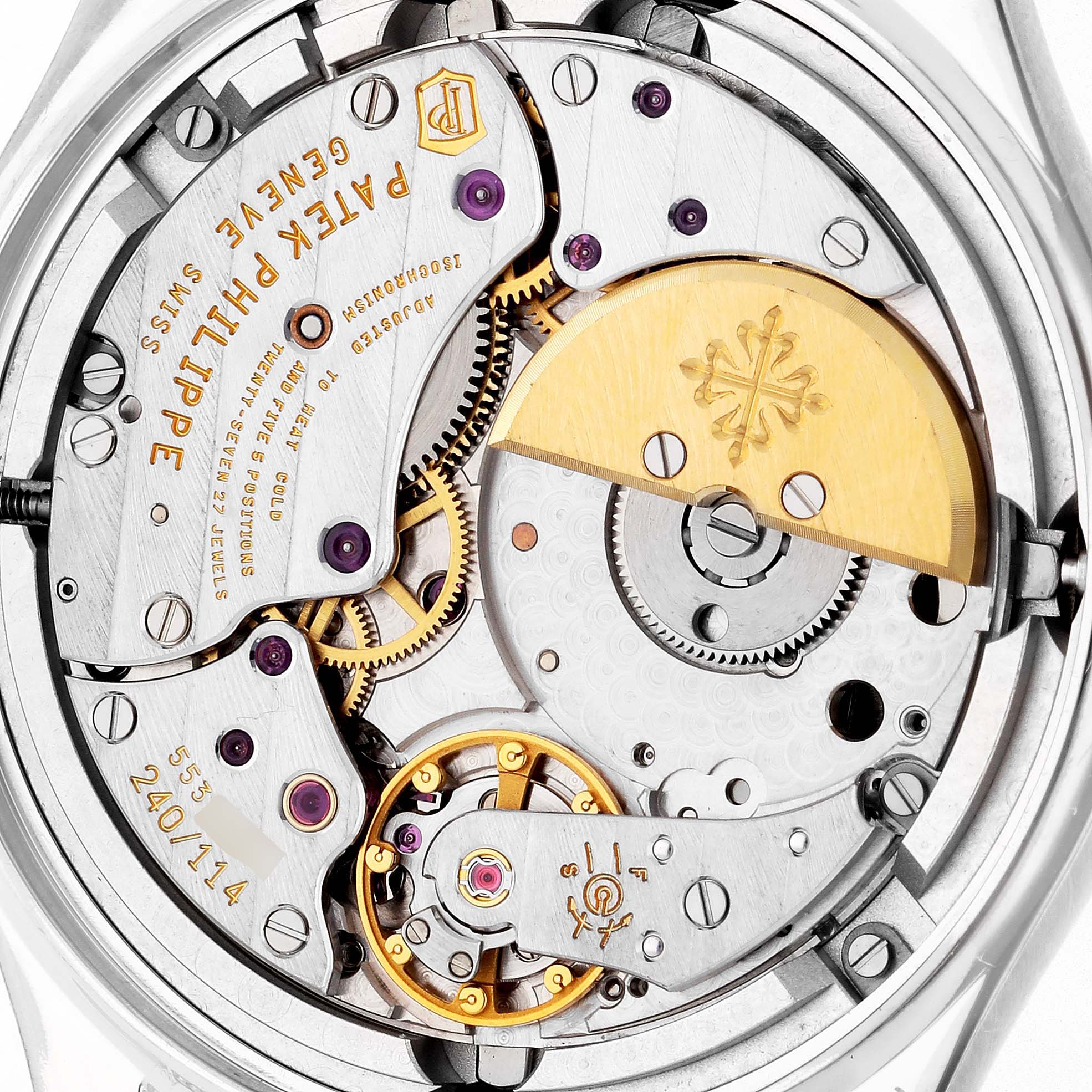 The image shows the movement's intricate inner workings from the back of a Patek Philippe Complications 5140G-001 Men's White Gold Silver Dial 5140G-001 Men's White Gold Silver Dial watch.