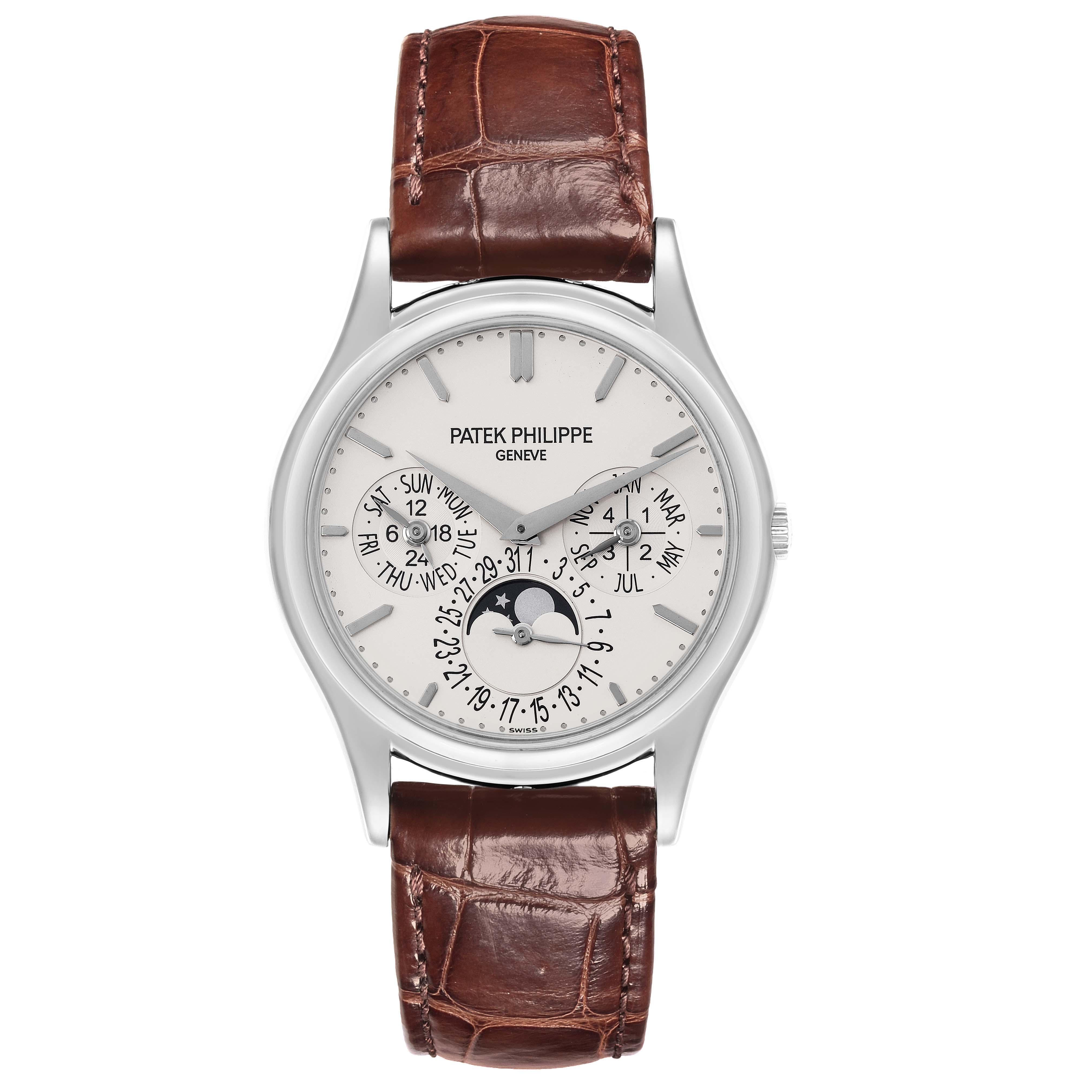 The image shows a Patek Philippe Complications 5140G-001 Men's White Gold Silver Dial 5140G-001 Men's White Gold Silver Dial watch from the front, highlighting its dial, hands, and leather strap.