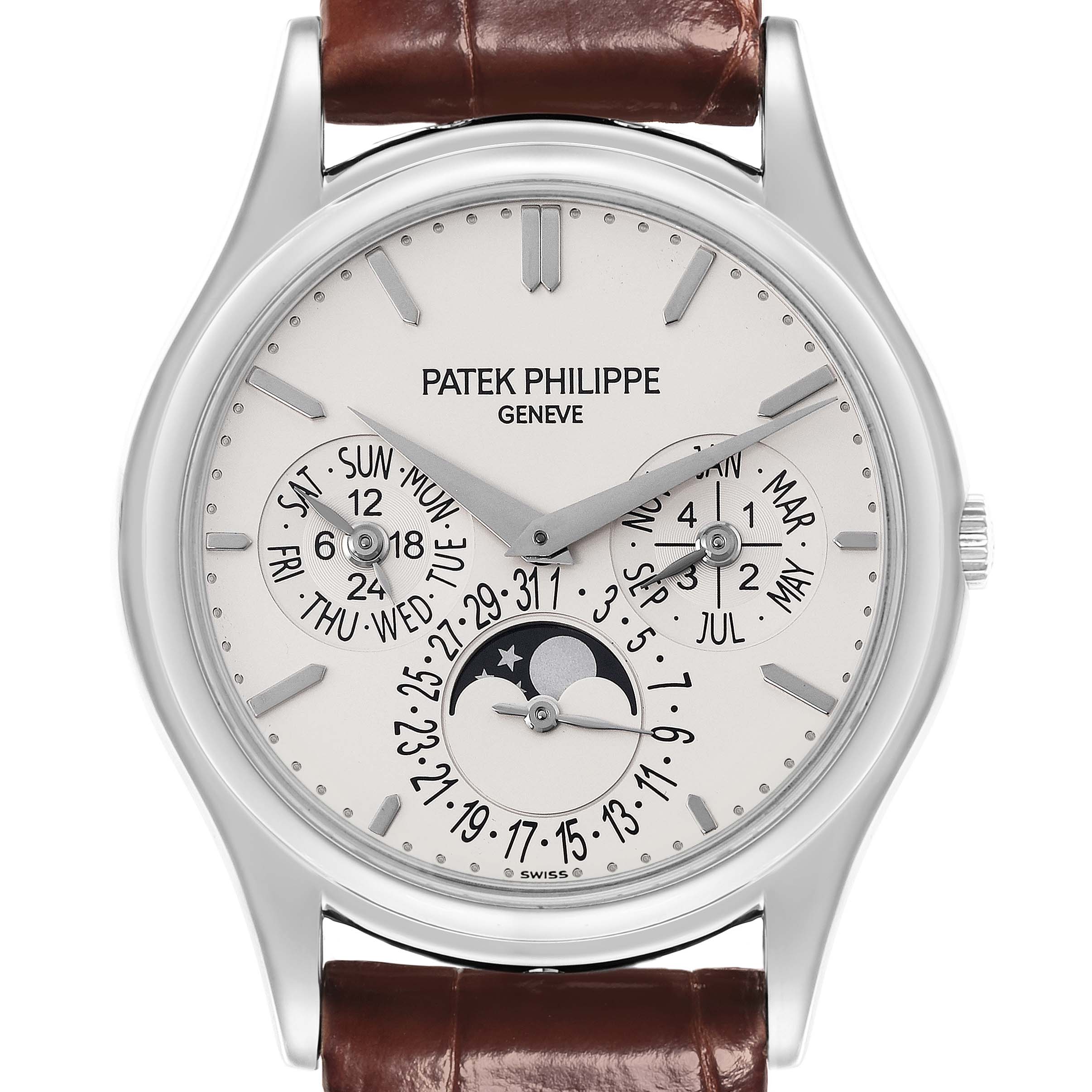 The image shows a Patek Philippe Complications 5140G-001 Men's White Gold Silver Dial 5140G-001 Men's White Gold Silver Dial watch face directly from the front, highlighting its dials, markers, and moon phase.