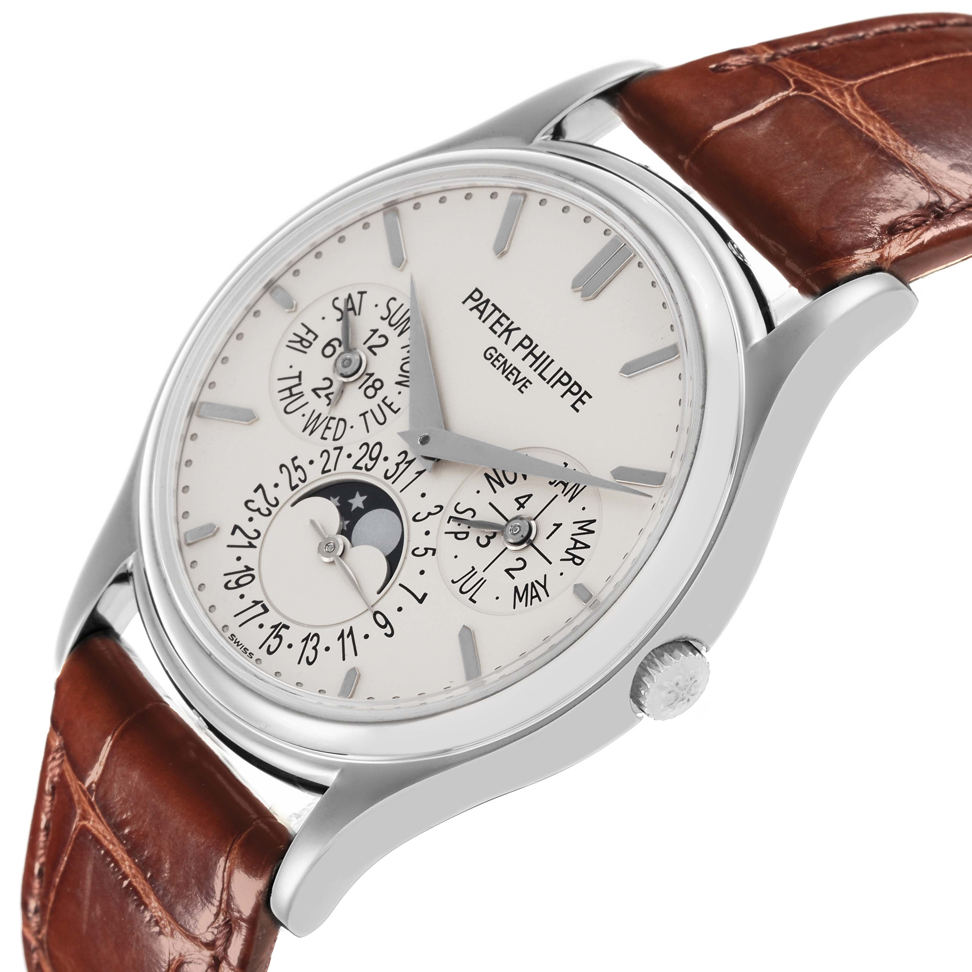 The Patek Philippe Complications 5140G-001 Men's White Gold Silver Dial 5140G-001 Men's White Gold Silver Dial watch is shown at an angled view displaying the dial, crown, and brown leather strap.