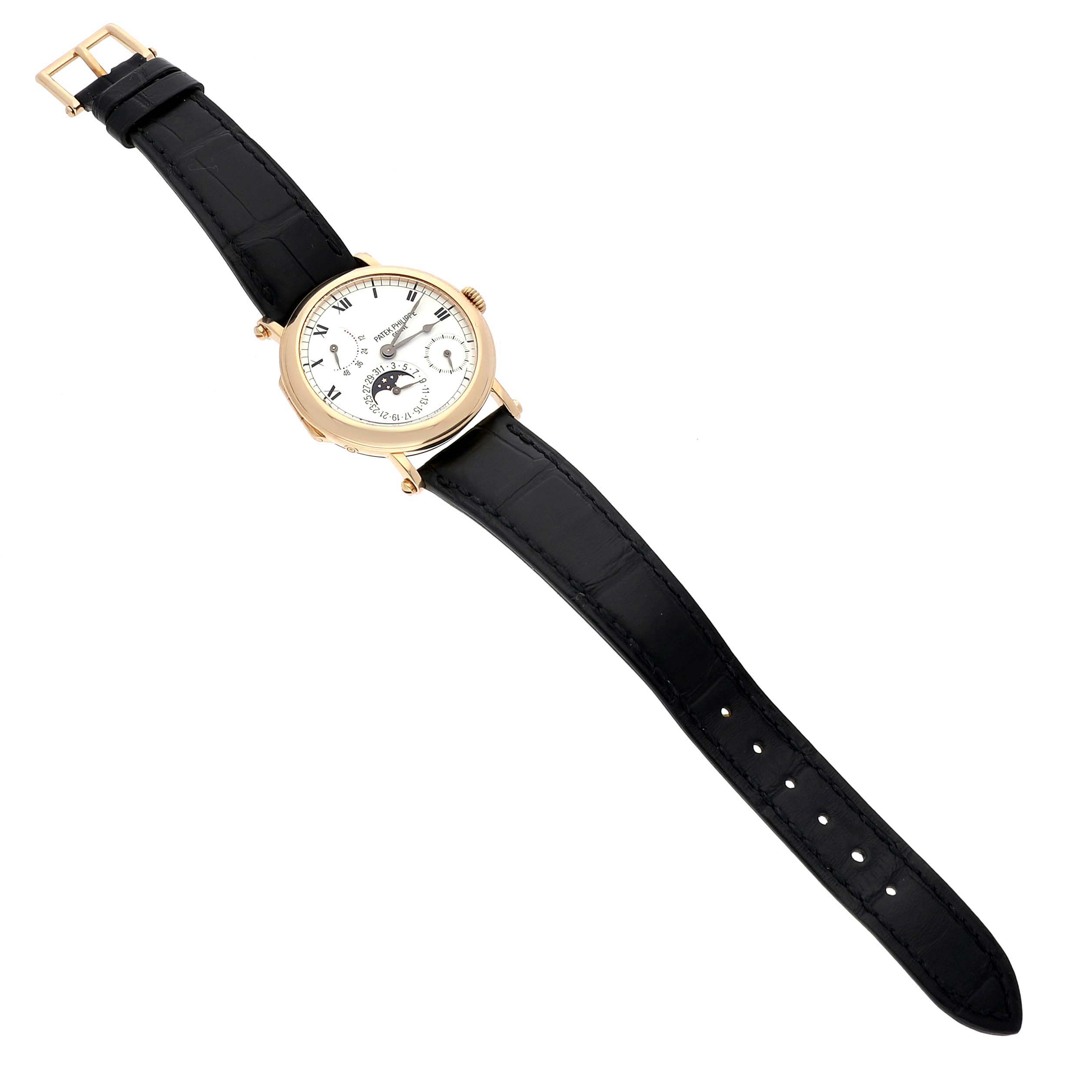 The Patek Philippe Complications 5054 Men's Yellow Gold White Dial watch is displayed at a slight angle, showing the black leather strap and detailed dial.