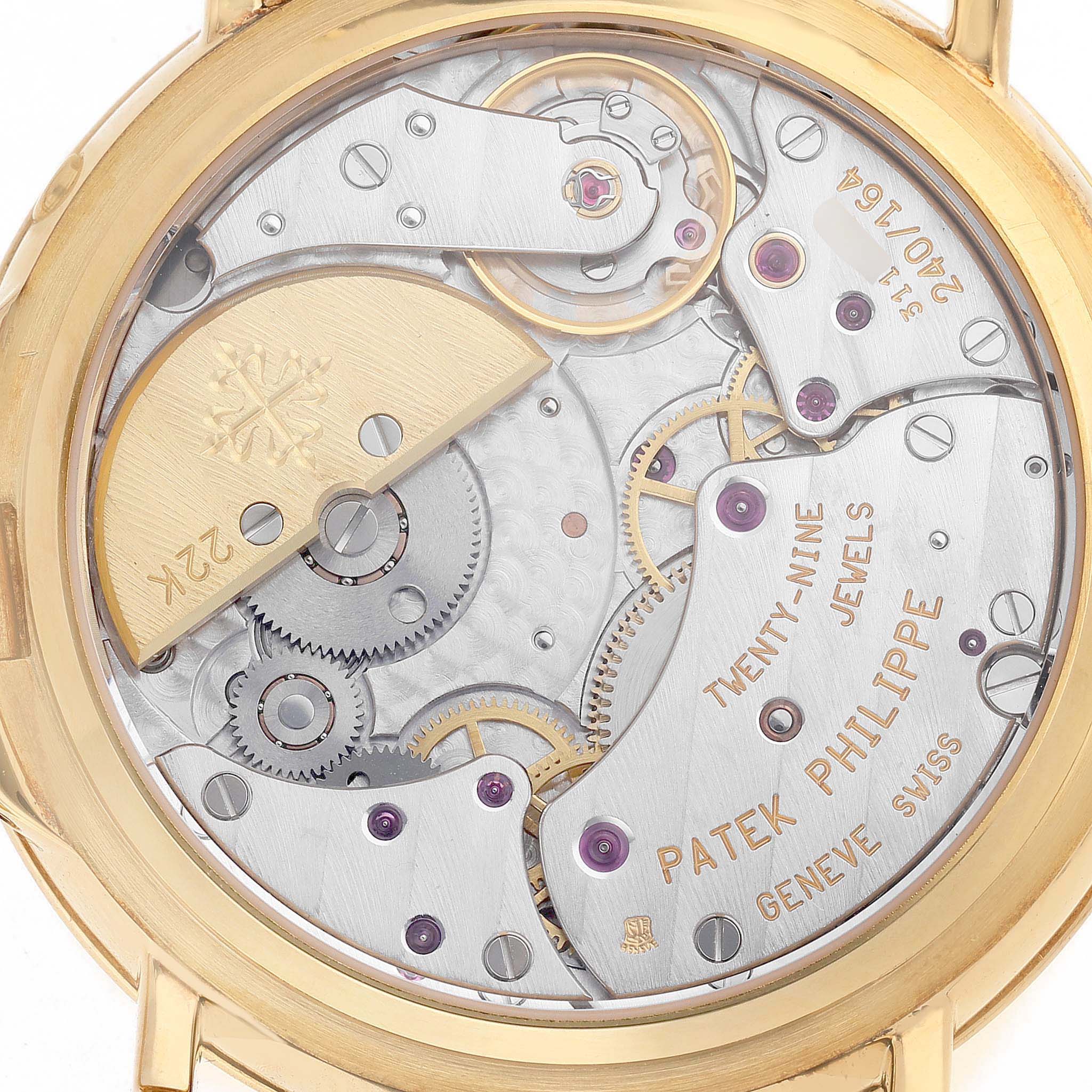 The image shows the back view of a Patek Philippe Complications 5054 Men's Yellow Gold White Dial watch displaying the intricate movement and internal components.