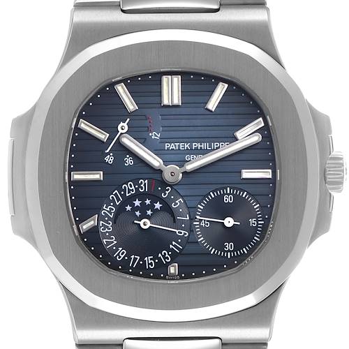 The Patek Philippe Nautilus 5712/1A-001 Men's Stainless Steel Blue Dial watch is shown from the front, displaying the dial, hands, subdials, and part of the bracelet.