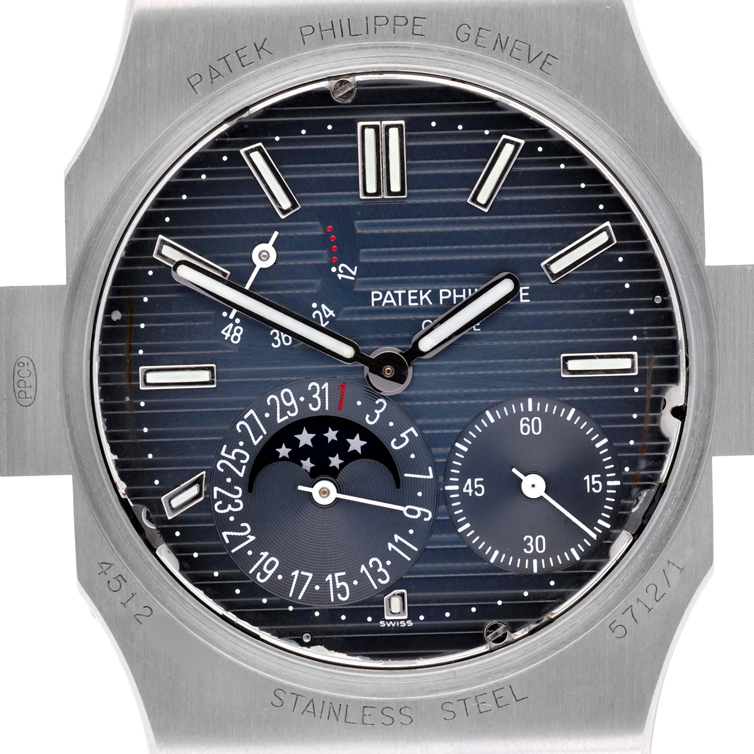 The image shows a close-up of a Patek Philippe Nautilus 5712/1A-001 Men's Stainless Steel Blue Dial watch face with hour, minute, and second indicators, plus a moon phase and date subdials.