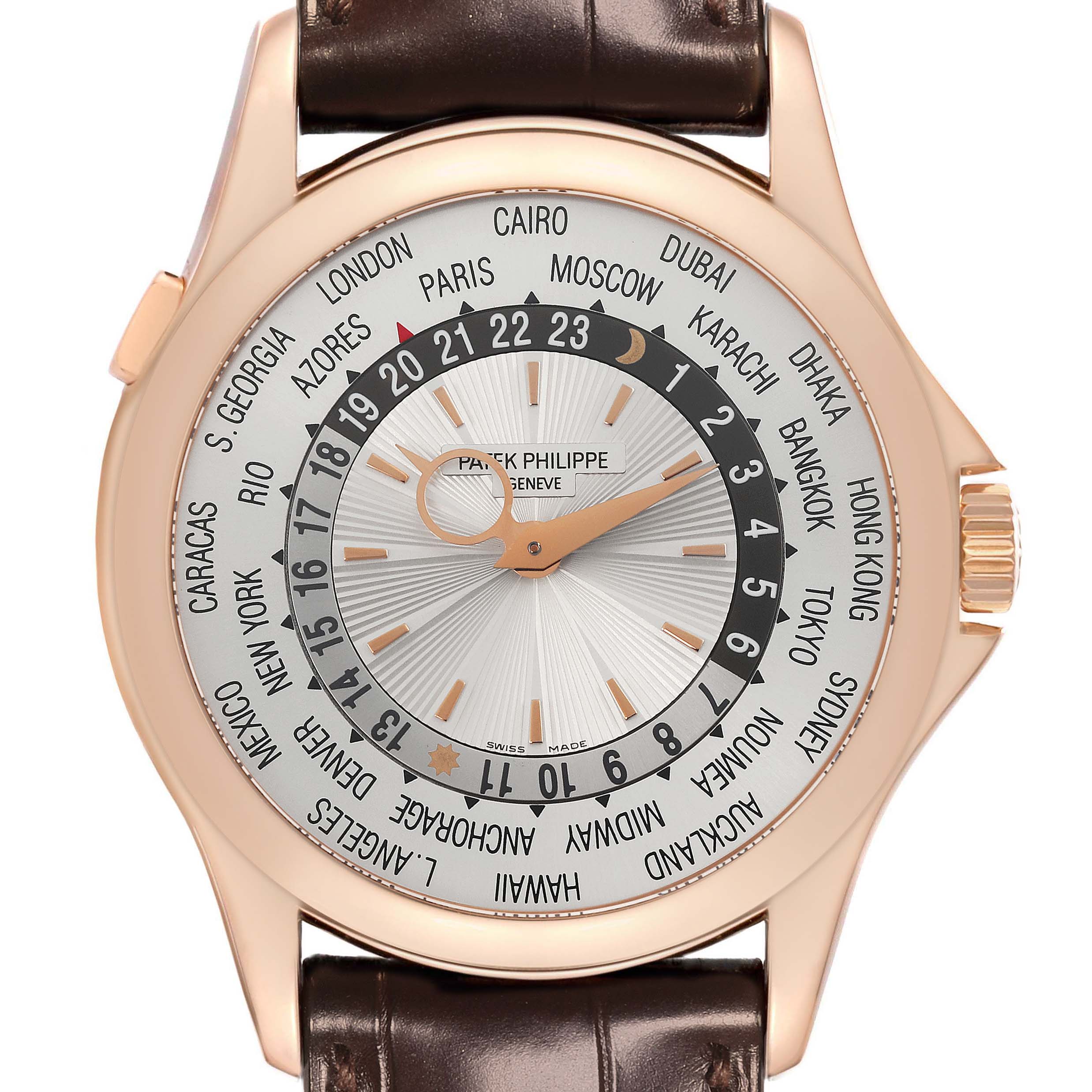 The Patek Philippe Complications 5130R-001 Men's Rose Gold Silver Dial 5130R-001 Men's Rose Gold Silver Dial watch is shown from the front, displaying its world time dial and brown leather strap.