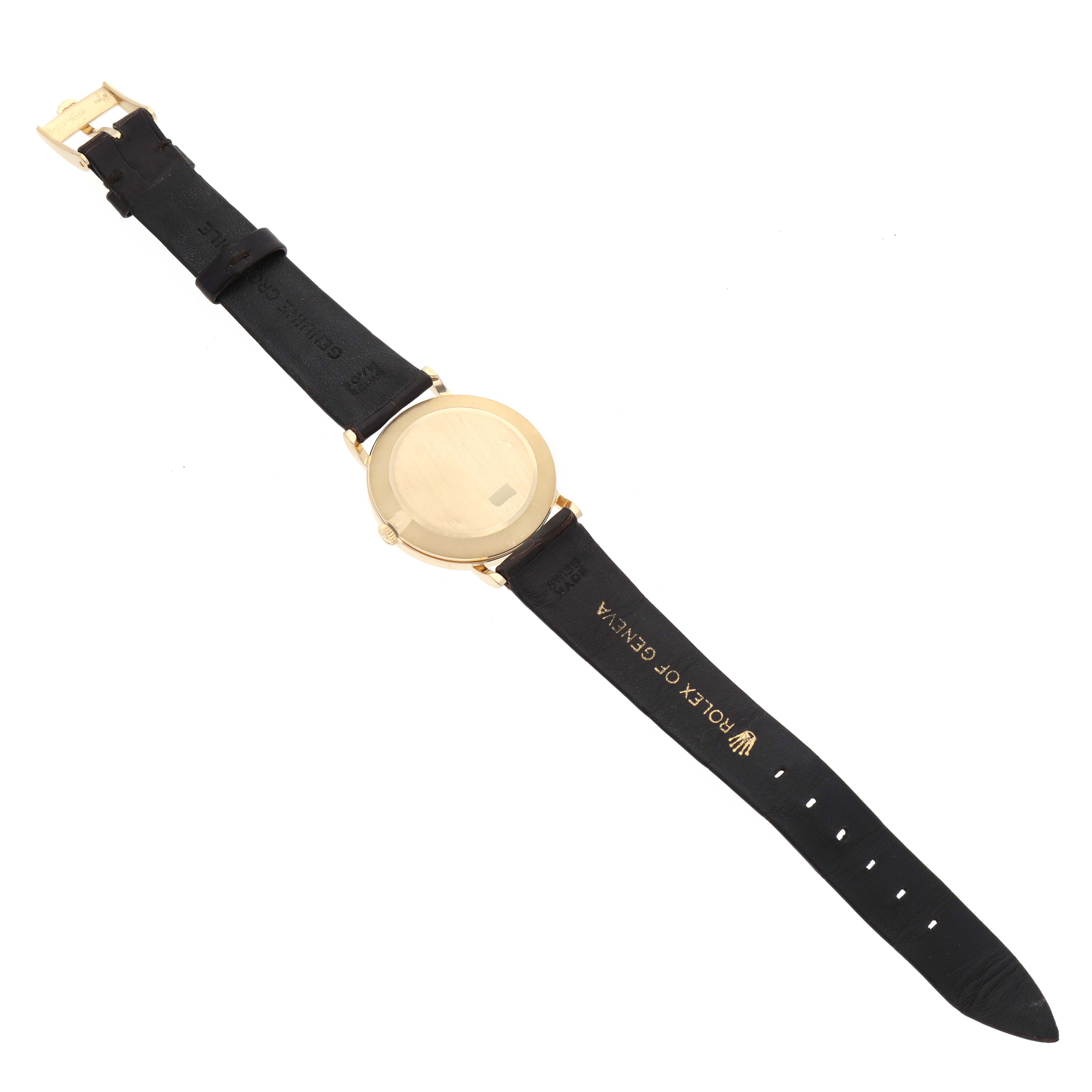 This image shows the rear view of a Rolex Cellini 5112 Men's Yellow Gold Beige Dial 5112 Men's Yellow Gold Beige Dial watch with its back case and black leather strap visible.