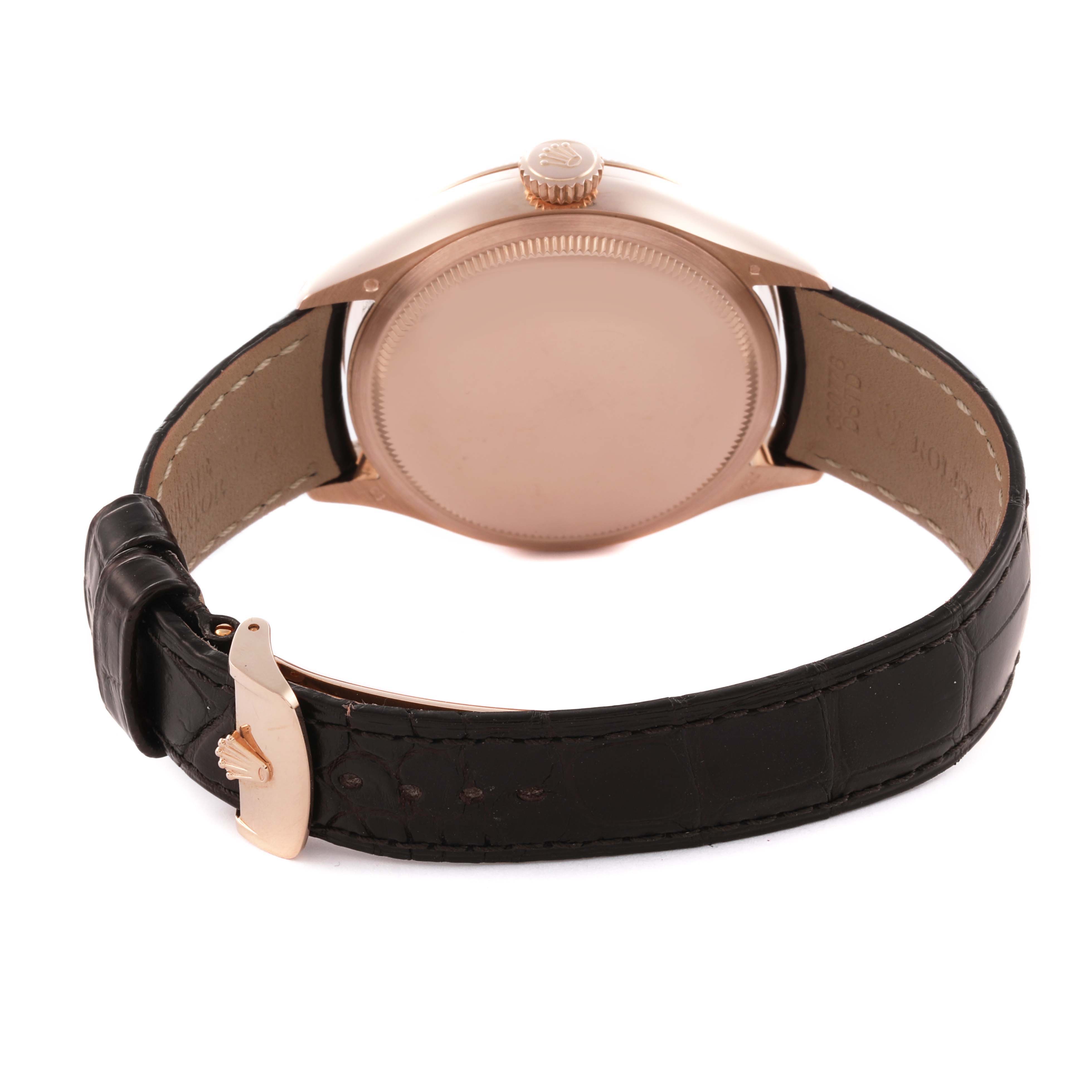 The image shows the back of the Rolex Cellini 50535 Men's Rose Gold White Dial 50535 Men's Rose Gold White Dial watch, featuring the case, crown, and leather strap with a clasp.