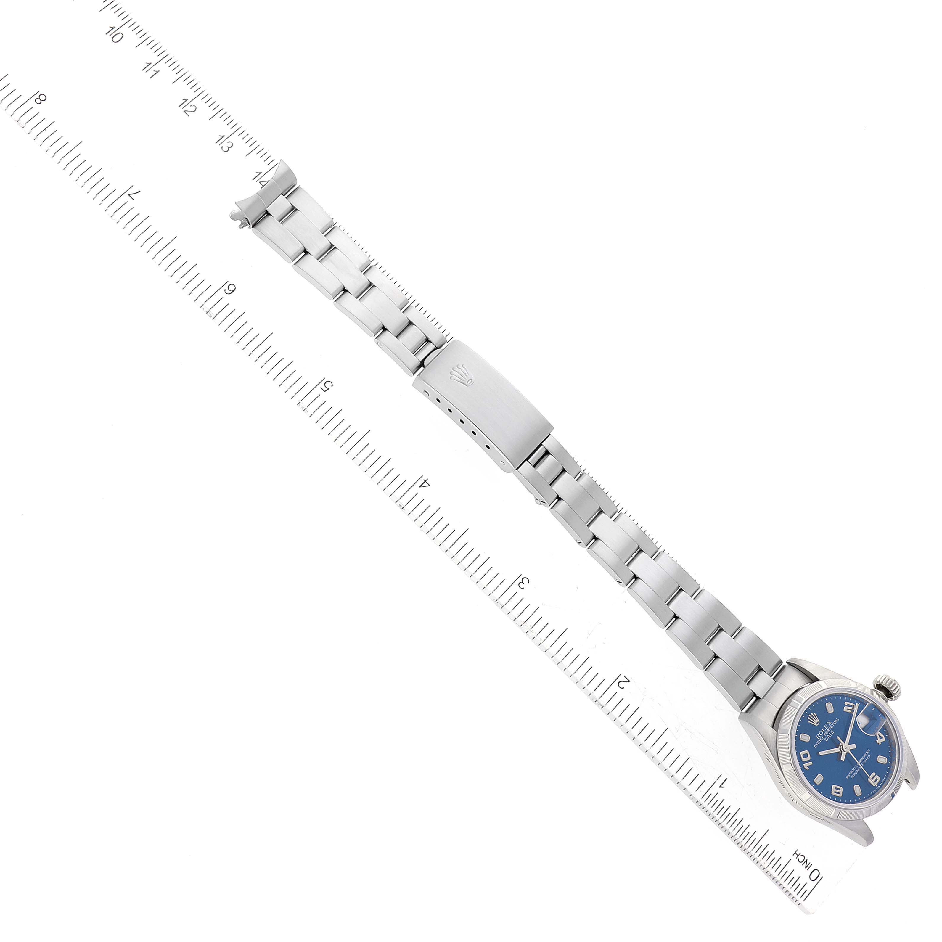 The Rolex Date 69190 Women's Stainless Steel Blue Dial 69190 Women's Stainless Steel Blue Dial watch is shown from an overhead angle, displaying the face, bracelet, and clasp.