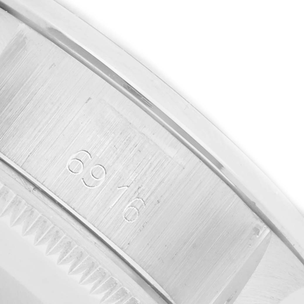 The image shows a close-up of the case side, with the model number engraving on the Rolex Date 6916 Women's Stainless Steel Silver Dial 6916 Women's Stainless Steel Silver Dial watch.