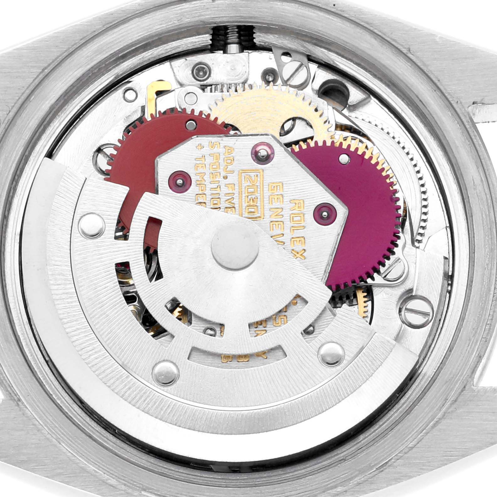 The image shows the detailed inner movement of a Rolex Date 6916 Women's Stainless Steel Silver Dial 6916 Women's Stainless Steel Silver Dial watch from a top-down angle, including gears and the rotor.