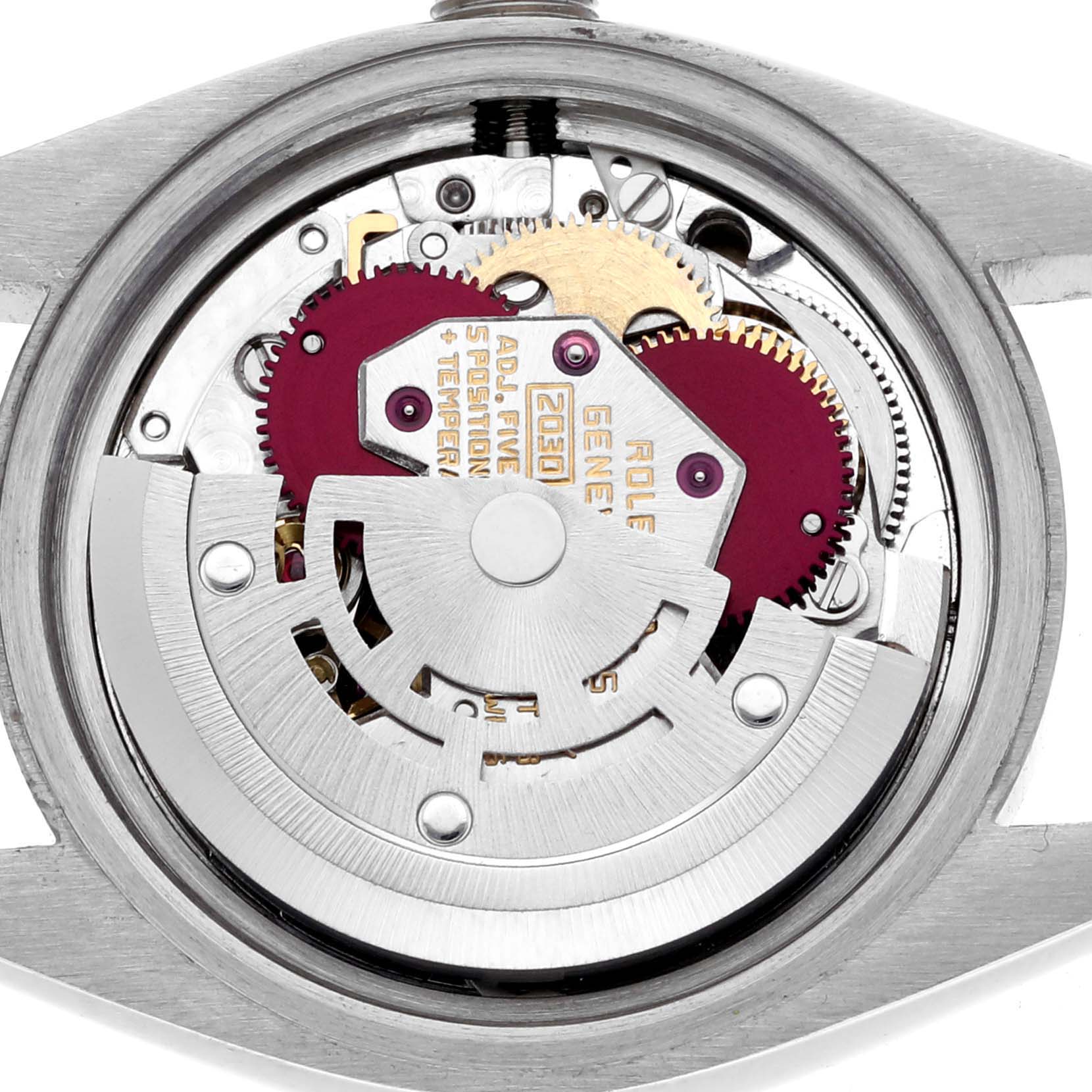 The image shows the movement of a Rolex Date 6917 Women's Stainless Steel Silver Dial 6917 Women's Stainless Steel Silver Dial model viewed from the back, highlighting gears and other mechanical components.