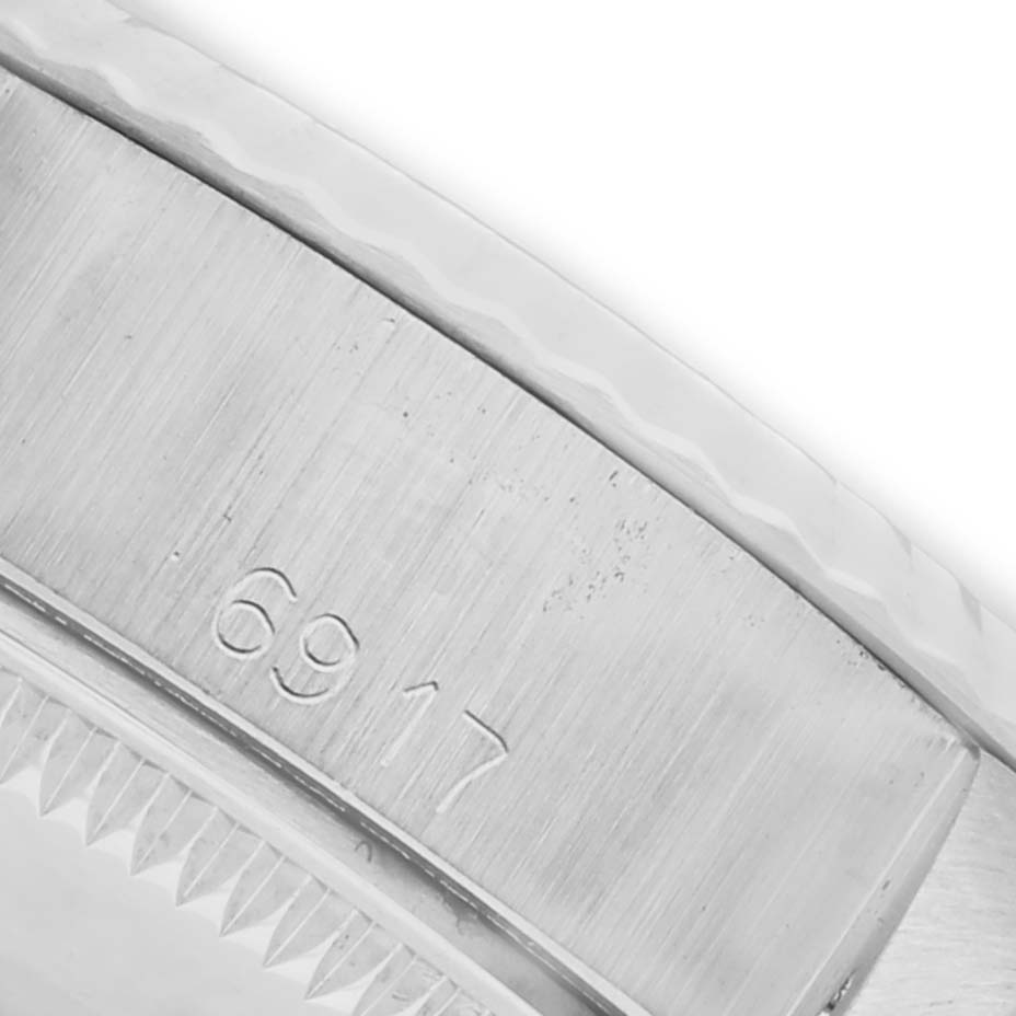 The image shows a close-up of the side case of a Rolex Date 6917 Women's Stainless Steel Silver Dial 6917 Women's Stainless Steel Silver Dial model, highlighting the model number "6917."