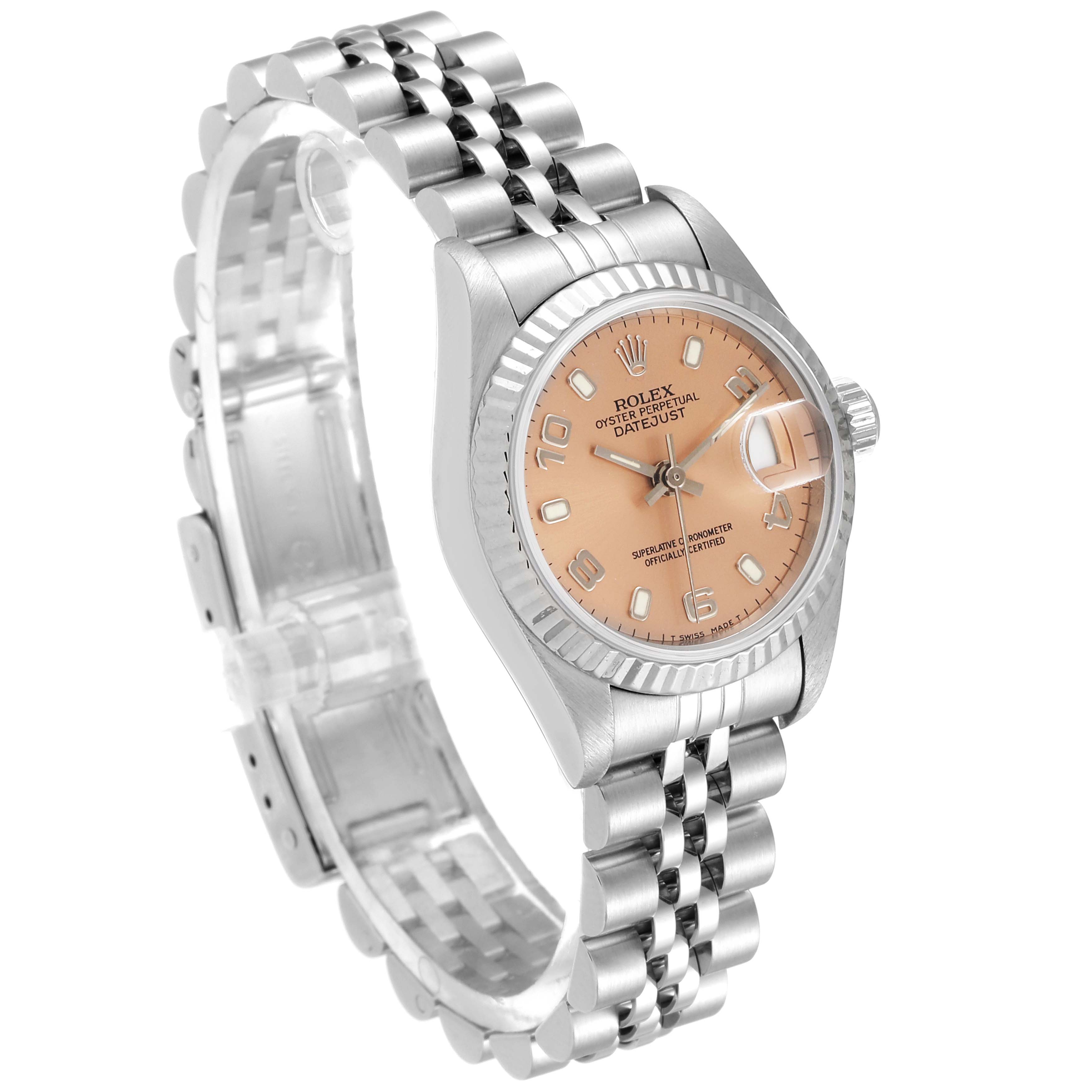 The image shows a Rolex Datejust 69174 Women's Stainless Steel Pink Dial 69174 Women's Stainless Steel Pink Dial watch at an angled view, highlighting its pink dial, jubilee bracelet, and fluted bezel.