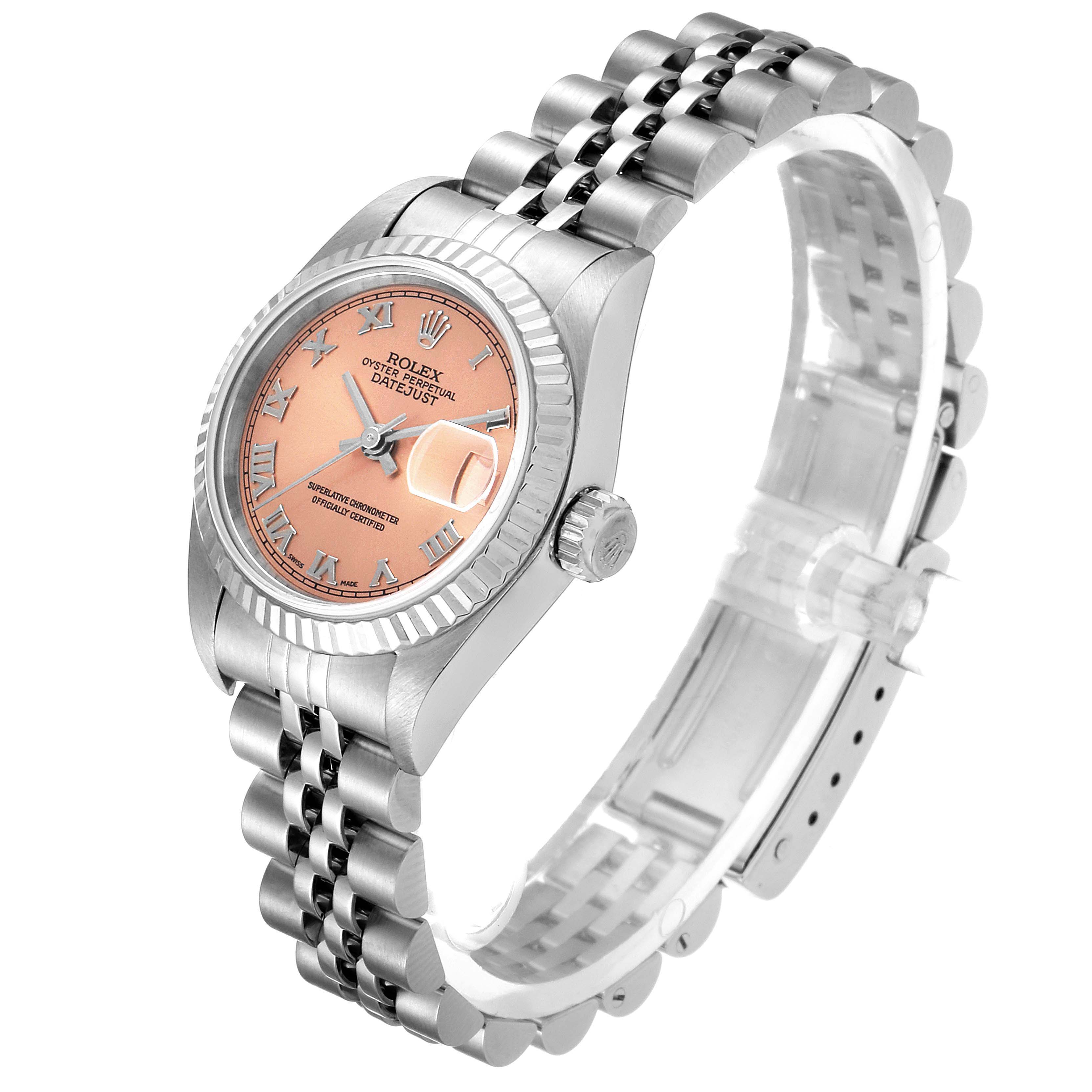 The image shows a Rolex Datejust 79174 Women's Stainless Steel Pink Dial 79174 Women's Stainless Steel Pink Dial watch from a slight angle, highlighting its dial, bezel, crown, and bracelet.