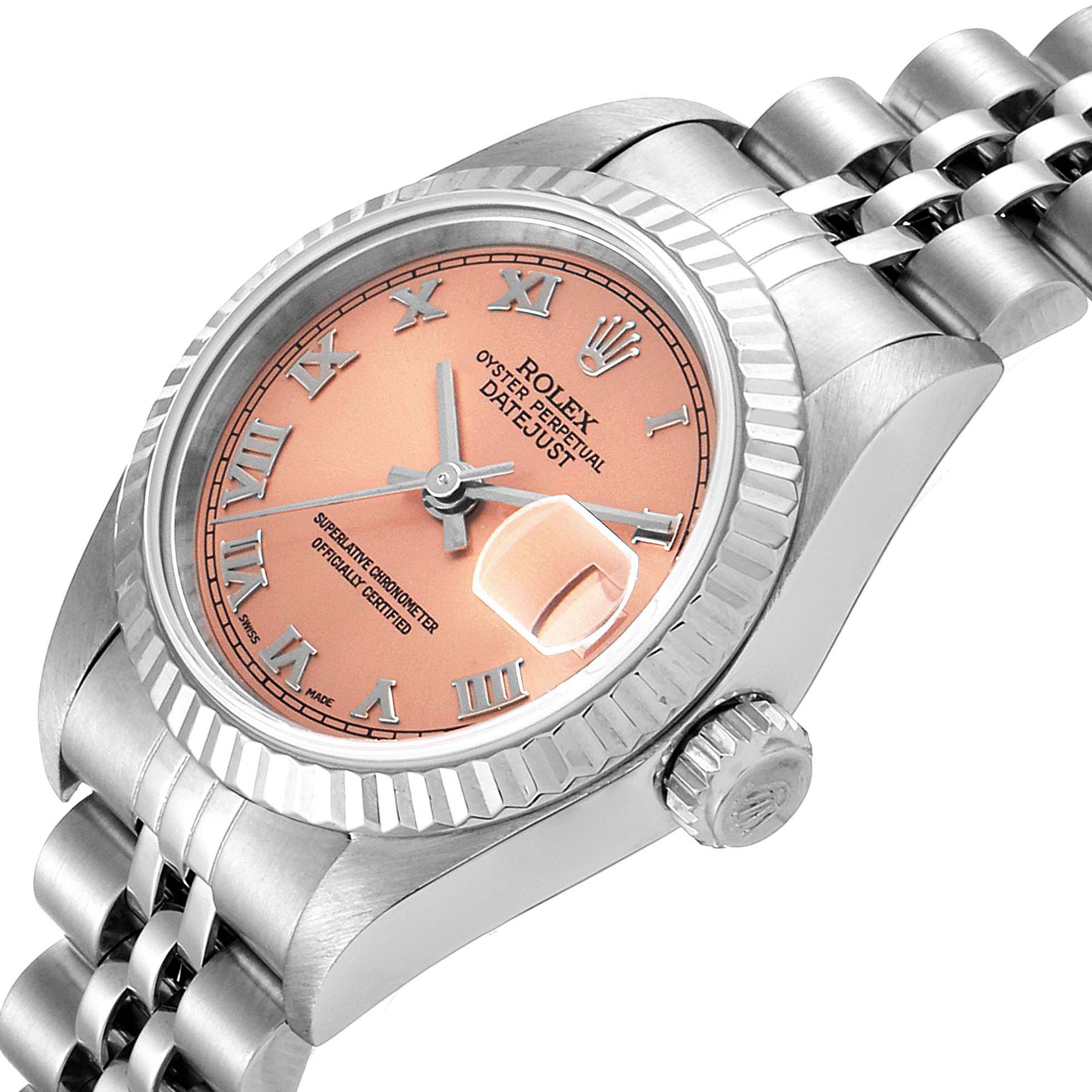 This image shows a Rolex Datejust 79174 Women's Stainless Steel Pink Dial 79174 Women's Stainless Steel Pink Dial watch from a right-side angle, displaying the peach dial, bezel, crown, and part of the bracelet.