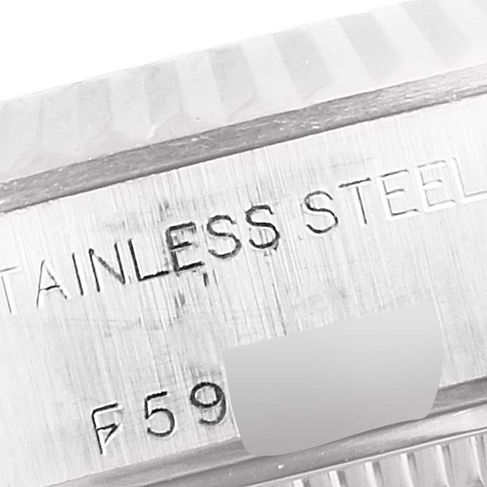 The image shows a close-up of the side case of the Rolex Datejust 79174 Women's Stainless Steel Pink Dial 79174 Women's Stainless Steel Pink Dial watch, specifically featuring the "STAINLESS STEEL" engraving.