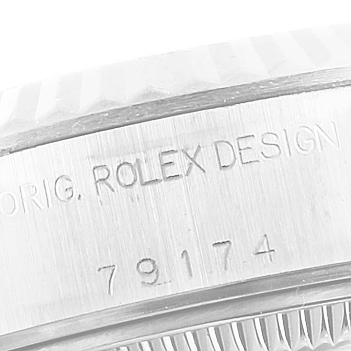 This image shows a close-up of the inner bezel inscription on a Rolex Datejust 79174 Women's Stainless Steel Pink Dial 79174 Women's Stainless Steel Pink Dial watch.