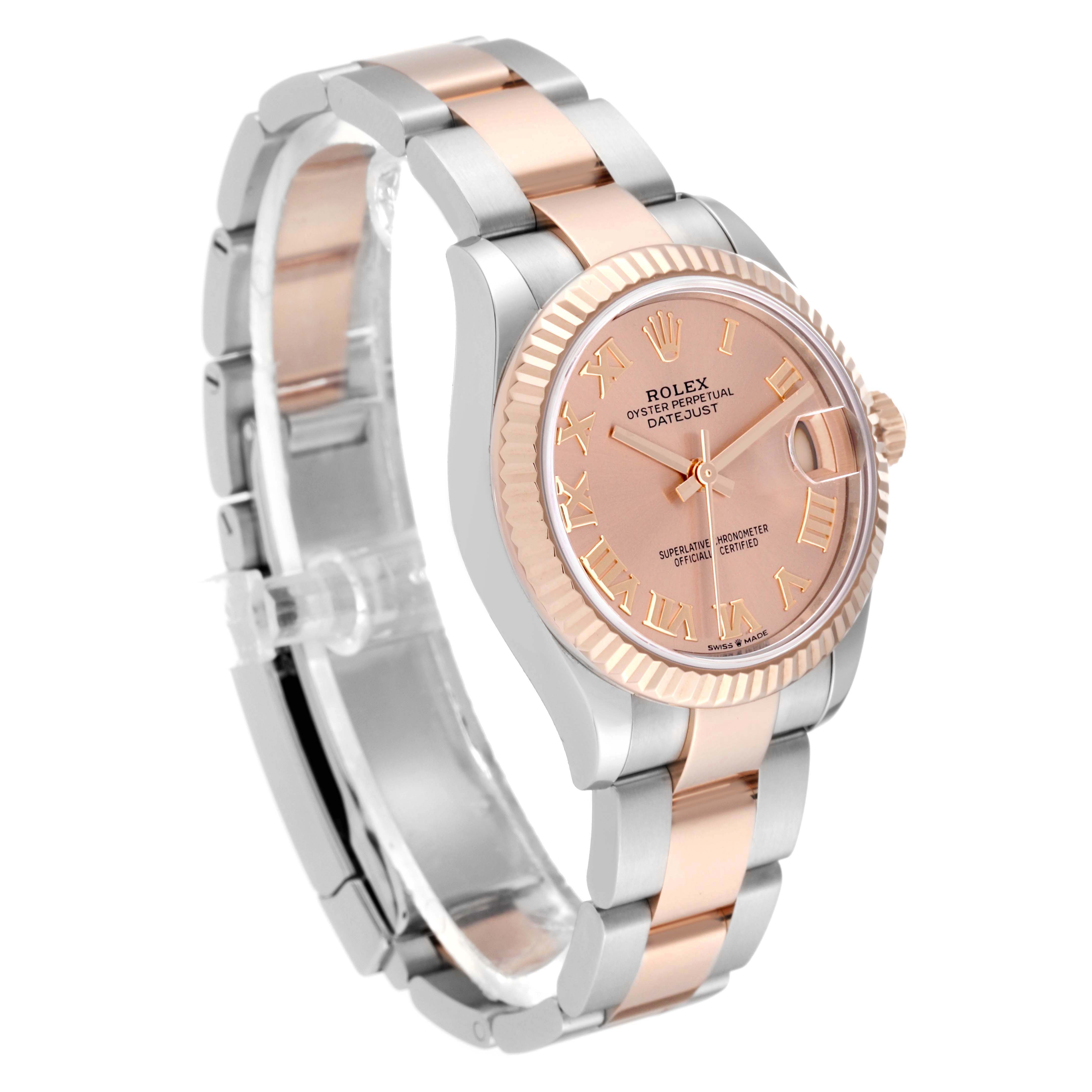 The Rolex Mid-Size 278271 Women's Steel and Gold (two tone) Pink Dial 278271 Women's Steel and Gold (two tone) Pink Dial model is shown at an angled view, highlighting the face, bezel, bracelet, and crown.