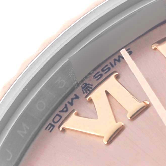 The image shows a close-up view of the Rolex Mid-Size 278271 Women's Steel and Gold (two tone) Pink Dial 278271 Women's Steel and Gold (two tone) Pink Dial watch's dial, highlighting the "VI" Roman numeral and "Swiss Made" text.