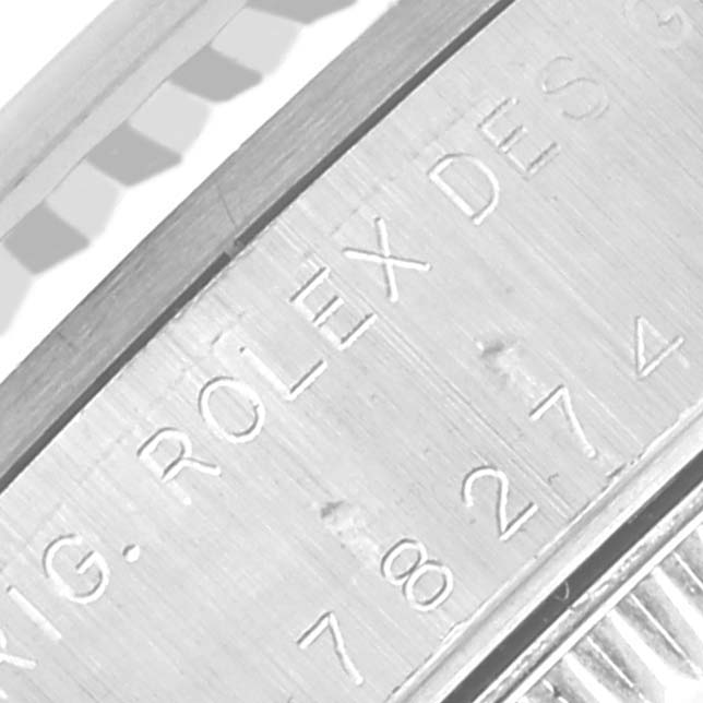 The image shows an engraved part of the case side of a Rolex Mid-Size 78274 Women's Stainless Steel Mother of Pearl Dial 78274 Women's Stainless Steel Mother of Pearl Dial model viewed closely.