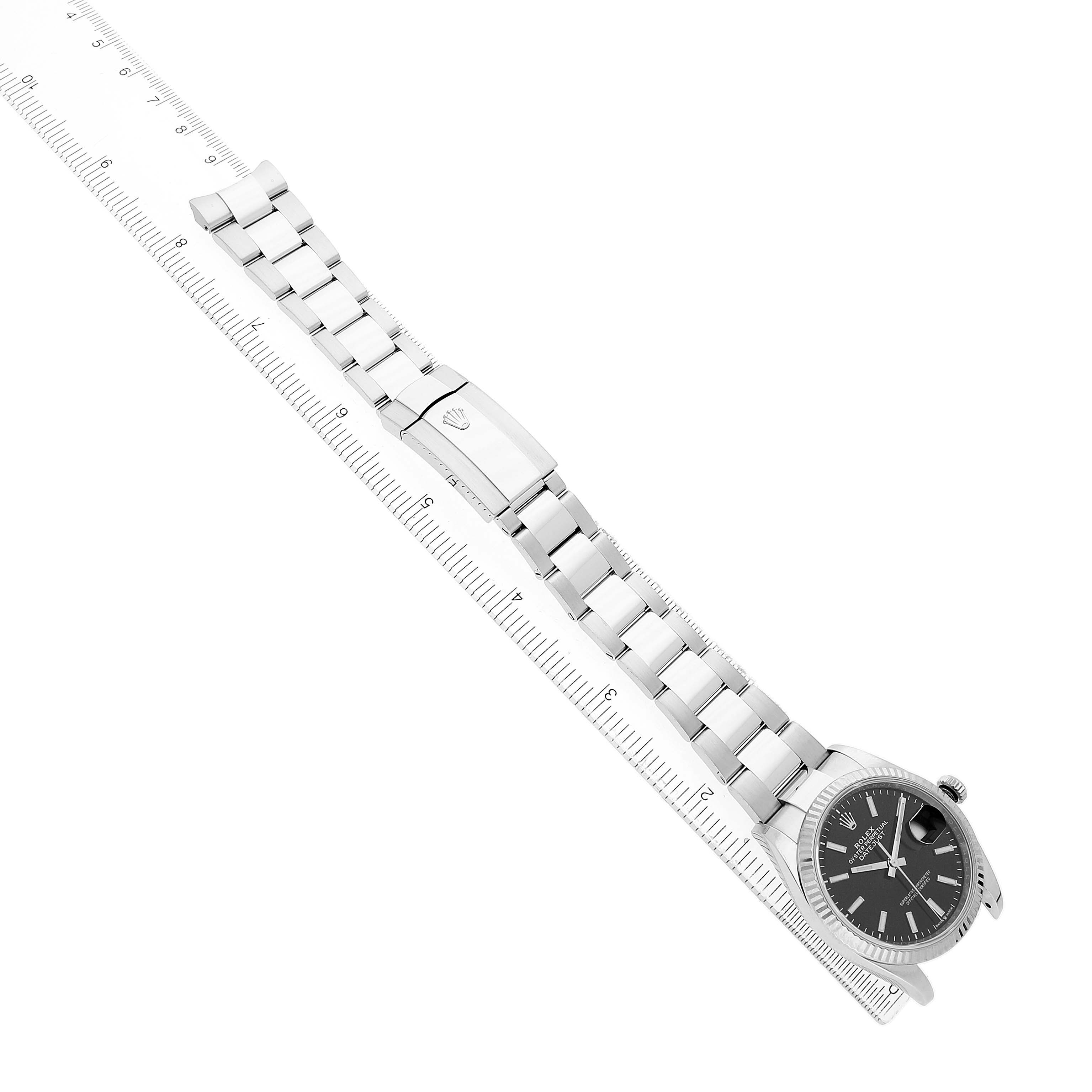 The Rolex Datejust 126234 Men's Steel and Gold (two tone) Black Dial watch is shown at an angled, overhead view, highlighting the bracelet and clasp.