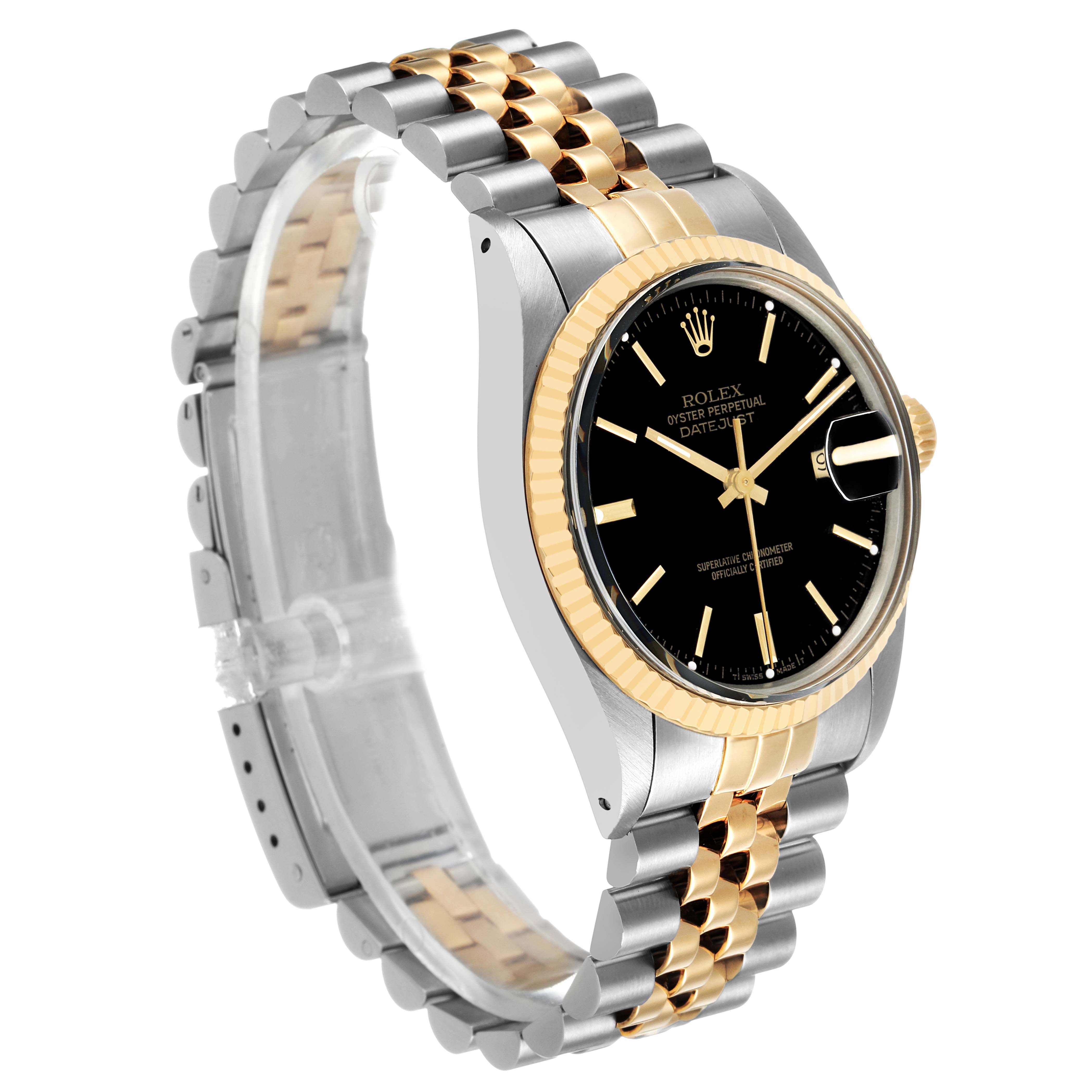The Rolex Datejust 16013 Men's Steel and Gold (two tone) Black Dial watch is shown at a three-quarter angle, highlighting the bezel, dial, case, and two-tone bracelet.