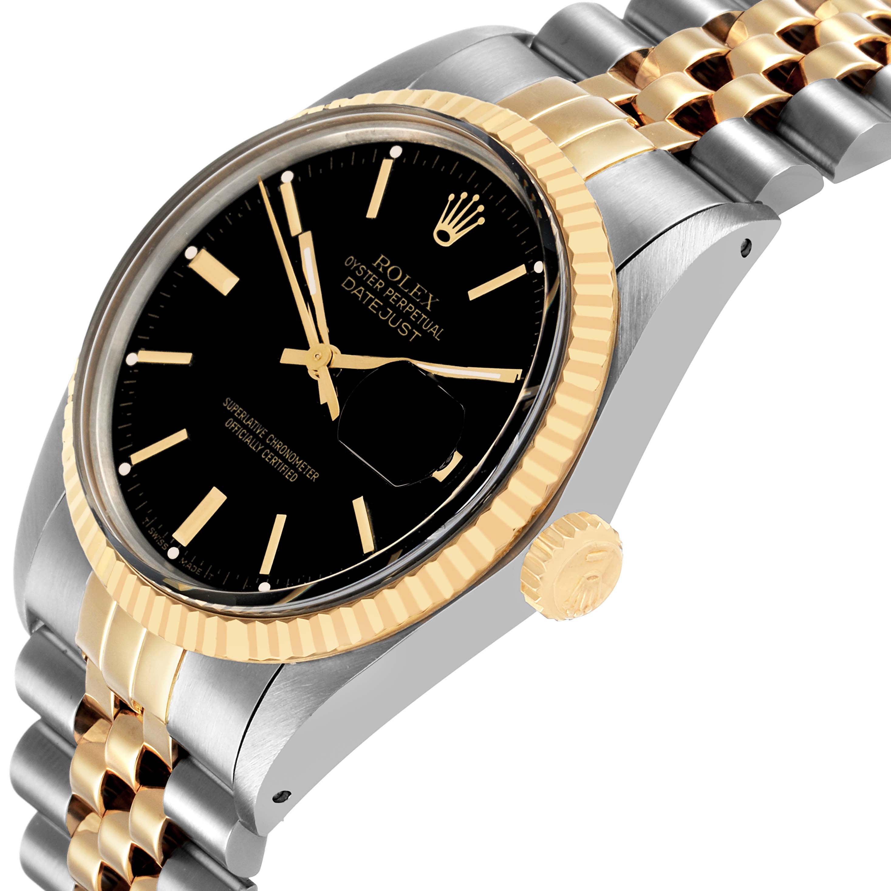 The Rolex Datejust 16013 Men's Steel and Gold (two tone) Black Dial watch is shown at a three-quarter angle, highlighting the bezel, crown, dial, and part of the bracelet.