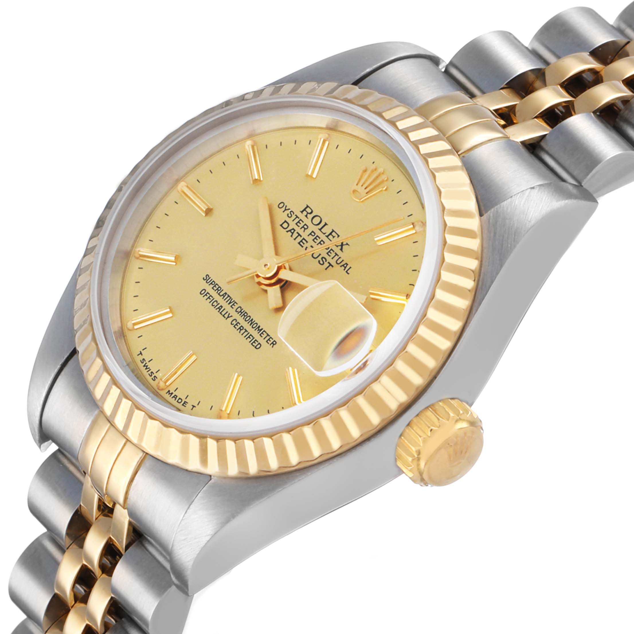 The Rolex Datejust 69173 Women's Steel and Gold (two tone) Champagne Dial watch is shown at an angled view highlighting the face, fluted bezel, crown, and two-tone bracelet.