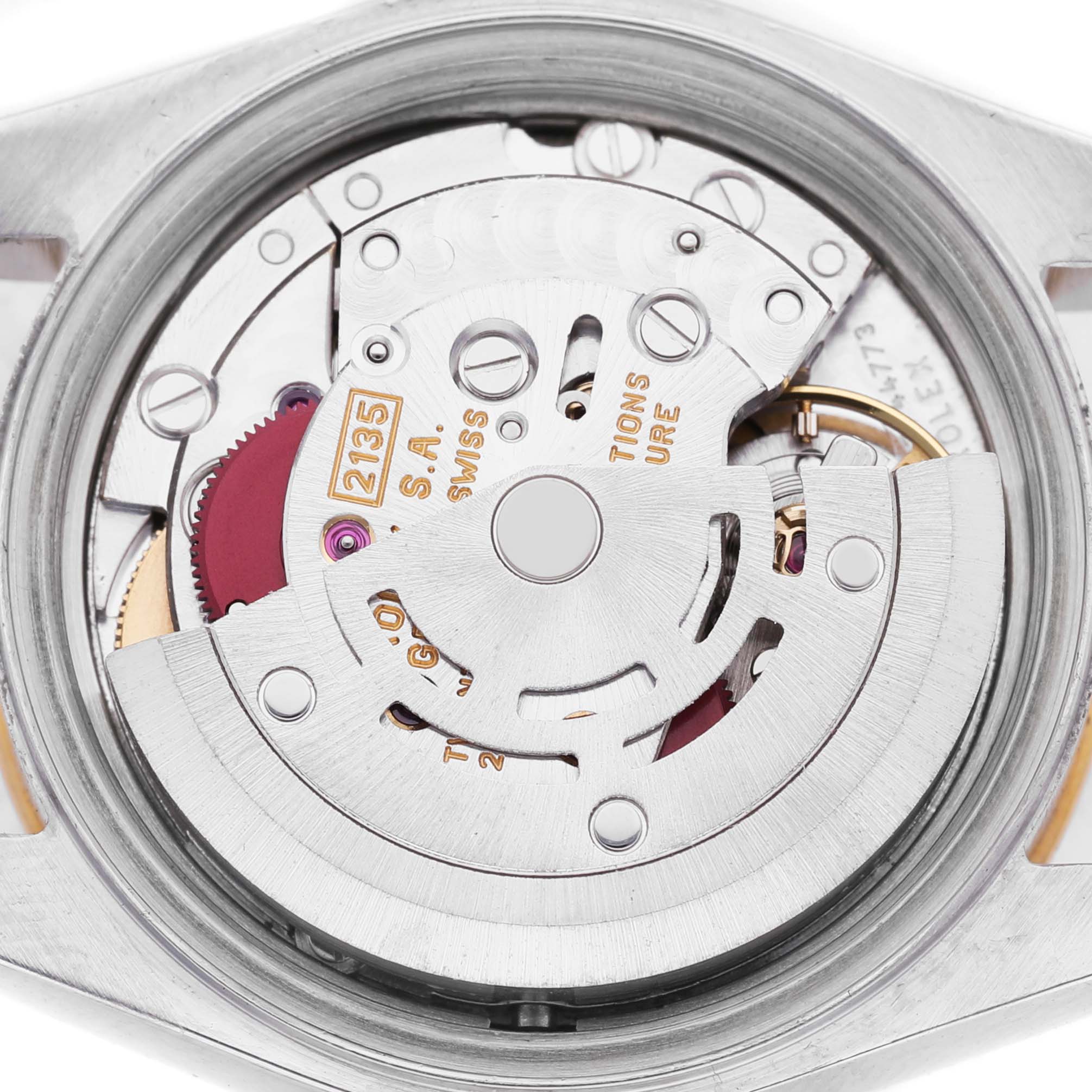 The image shows the movement and inner workings of a Rolex Datejust 69173 Women's Steel and Gold (two tone) Champagne Dial watch viewed from the back.