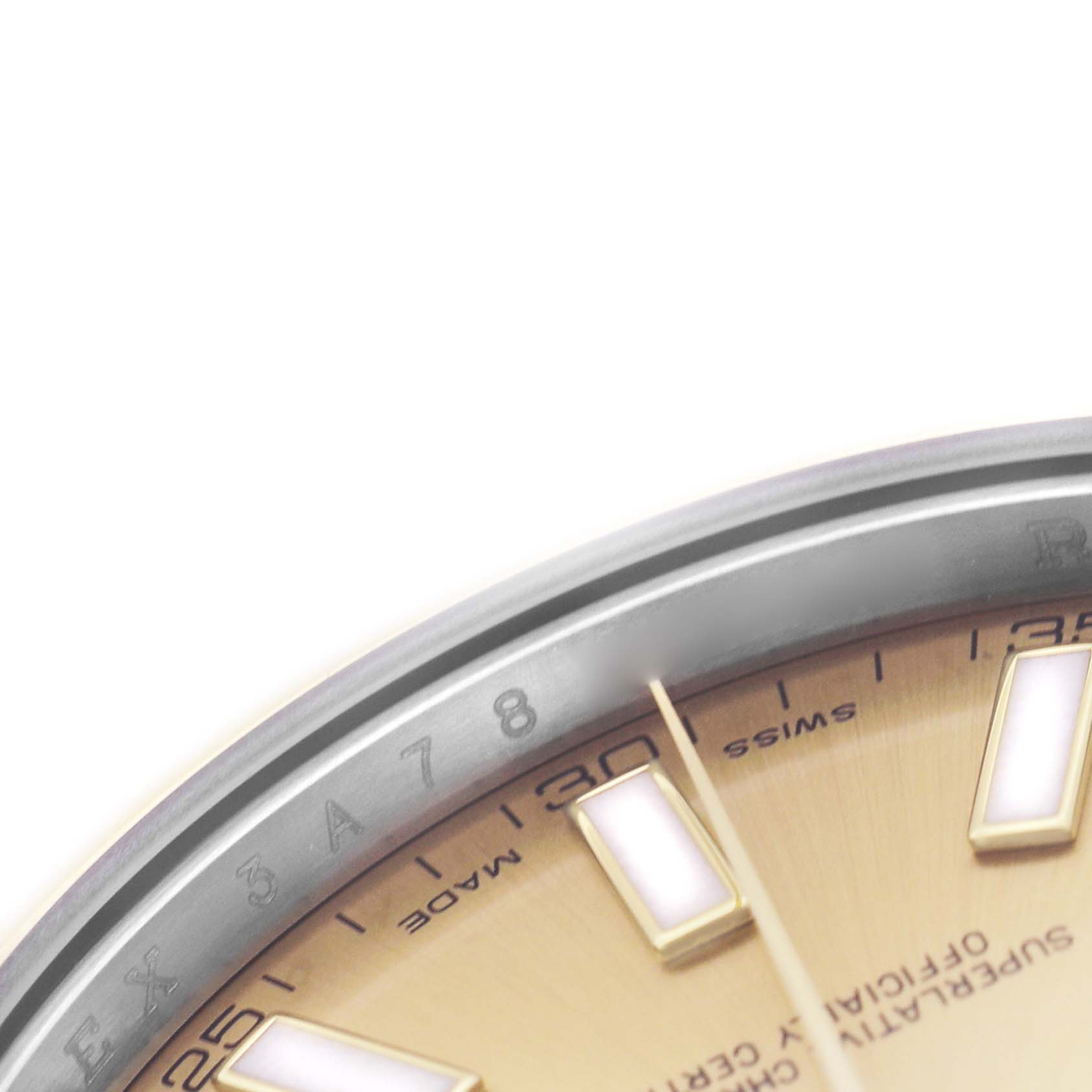 The image shows a close-up of the Rolex Datejust 41 116333 Men's Steel and Gold (two tone) Champagne Dial's bezel and partial dial, highlighting the hour markers and minute markers.