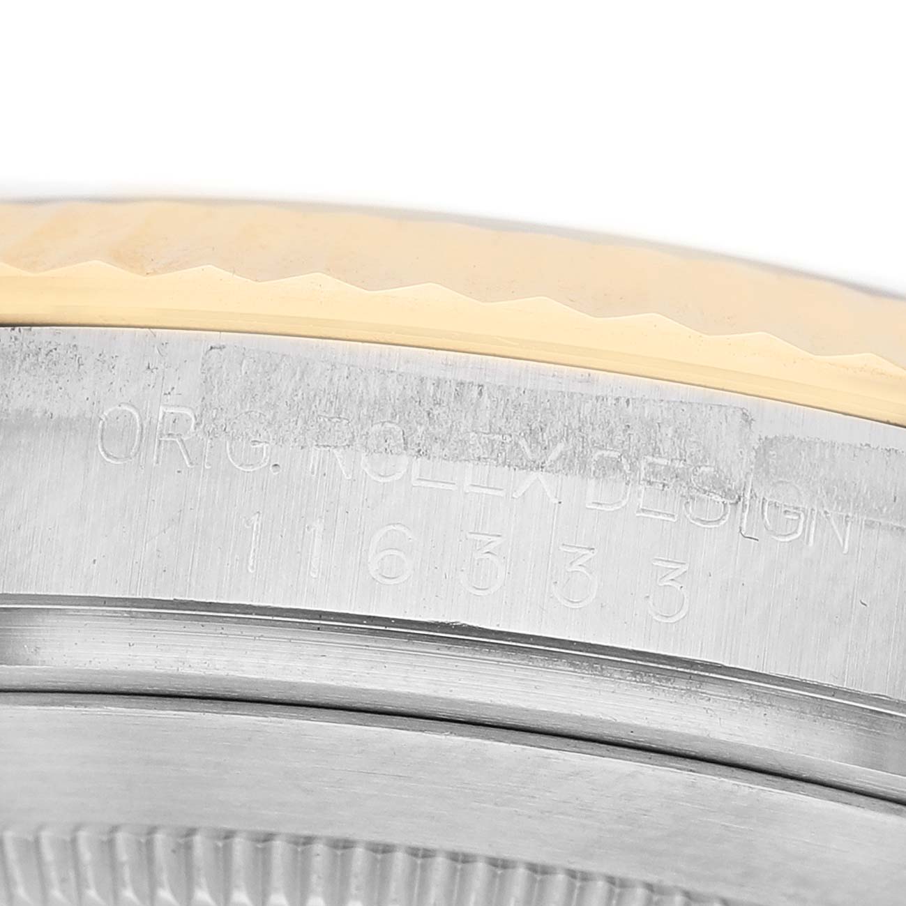 The image shows a close-up of the side of a Rolex Datejust 41 116333 Men's Steel and Gold (two tone) Silver Dial, highlighting the engraved serial and model numbers.