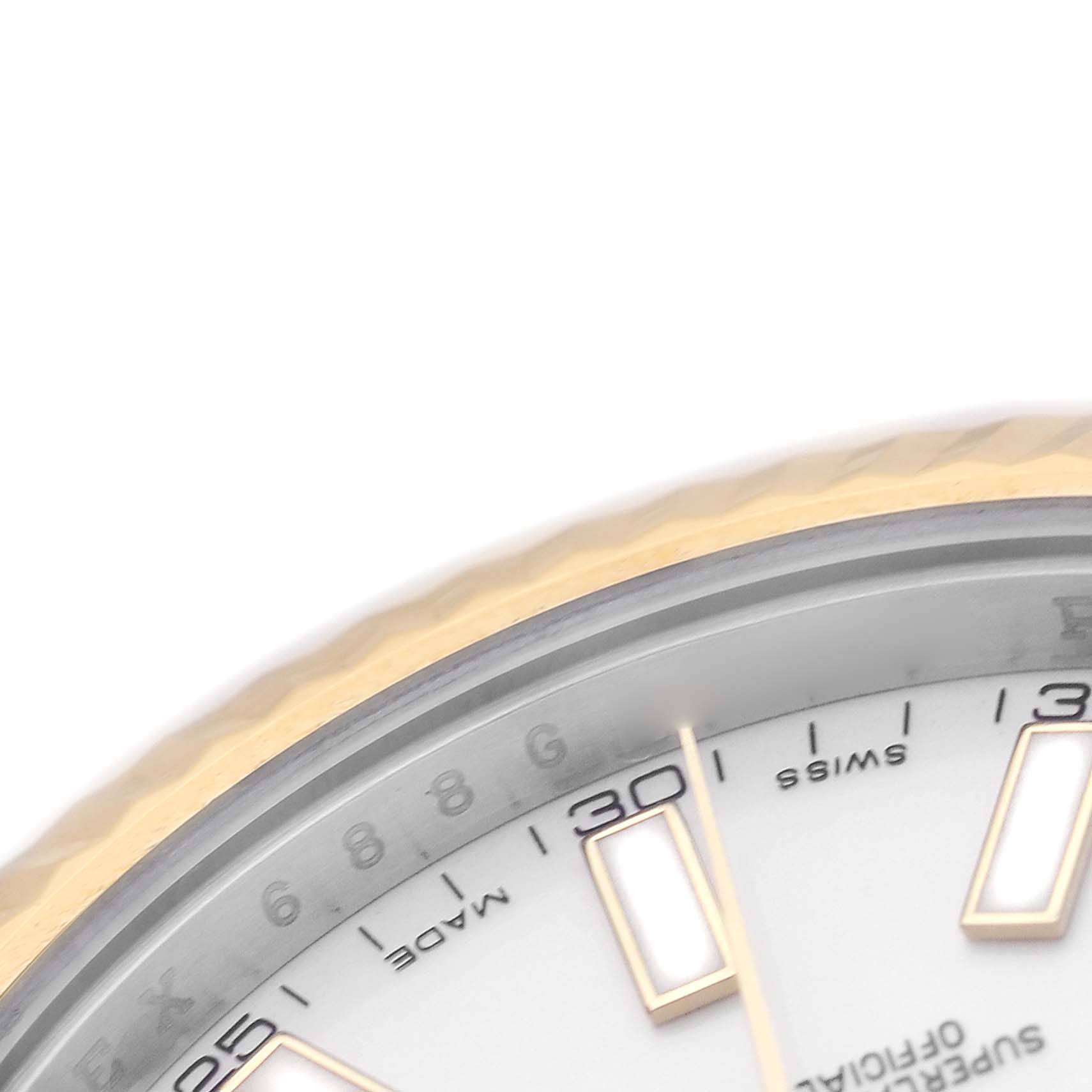 This image shows a close-up angle of a Rolex Datejust 41 116333 Men's Steel and Gold (two tone) Silver Dial, highlighting the bezel edge and part of the dial with markers.