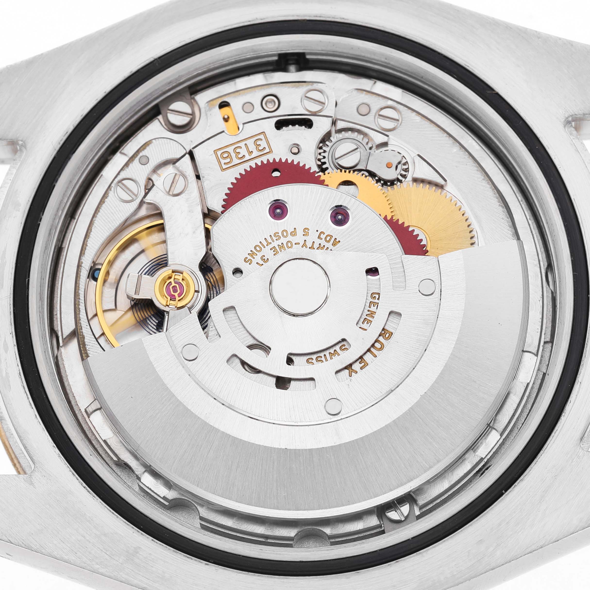 The image shows the movement of a Rolex Datejust 41 116333 Men's Steel and Gold (two tone) Silver Dial, featuring gears, rotors, and other internal components from a top-down angle.