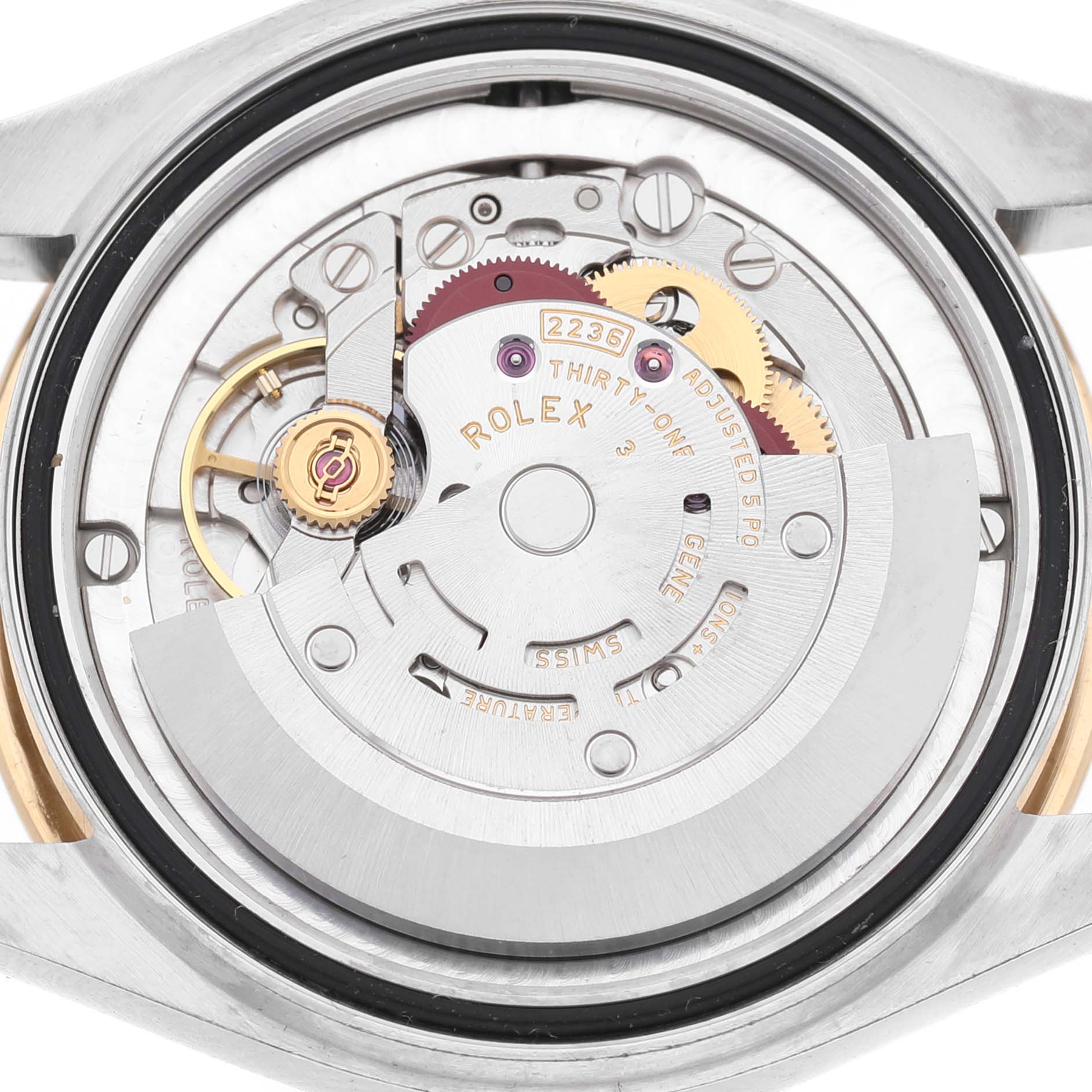 The image shows the movement of a Rolex Mid-Size 278273 Women's Steel and Gold (two tone) Champagne Dial watch from a rear angle, highlighting gears and the rotor.