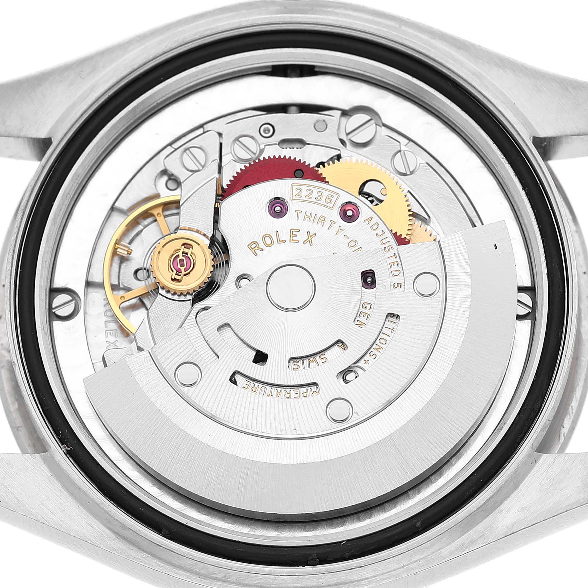 The image shows the movement of a Rolex Datejust 278274 Women's Stainless Steel Grey Dial watch, highlighting the rotor and gears, viewed from the back.