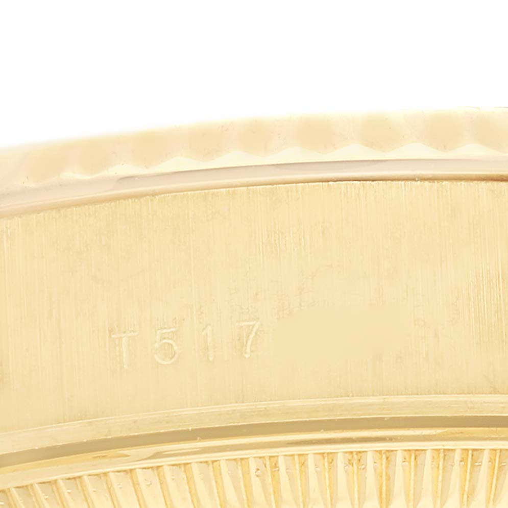 This close-up image shows the side view of the bezel and part of the case of a Rolex President 69178 Women's Yellow Gold Champagne Dial 69178 Women's Yellow Gold Champagne Dial model watch.