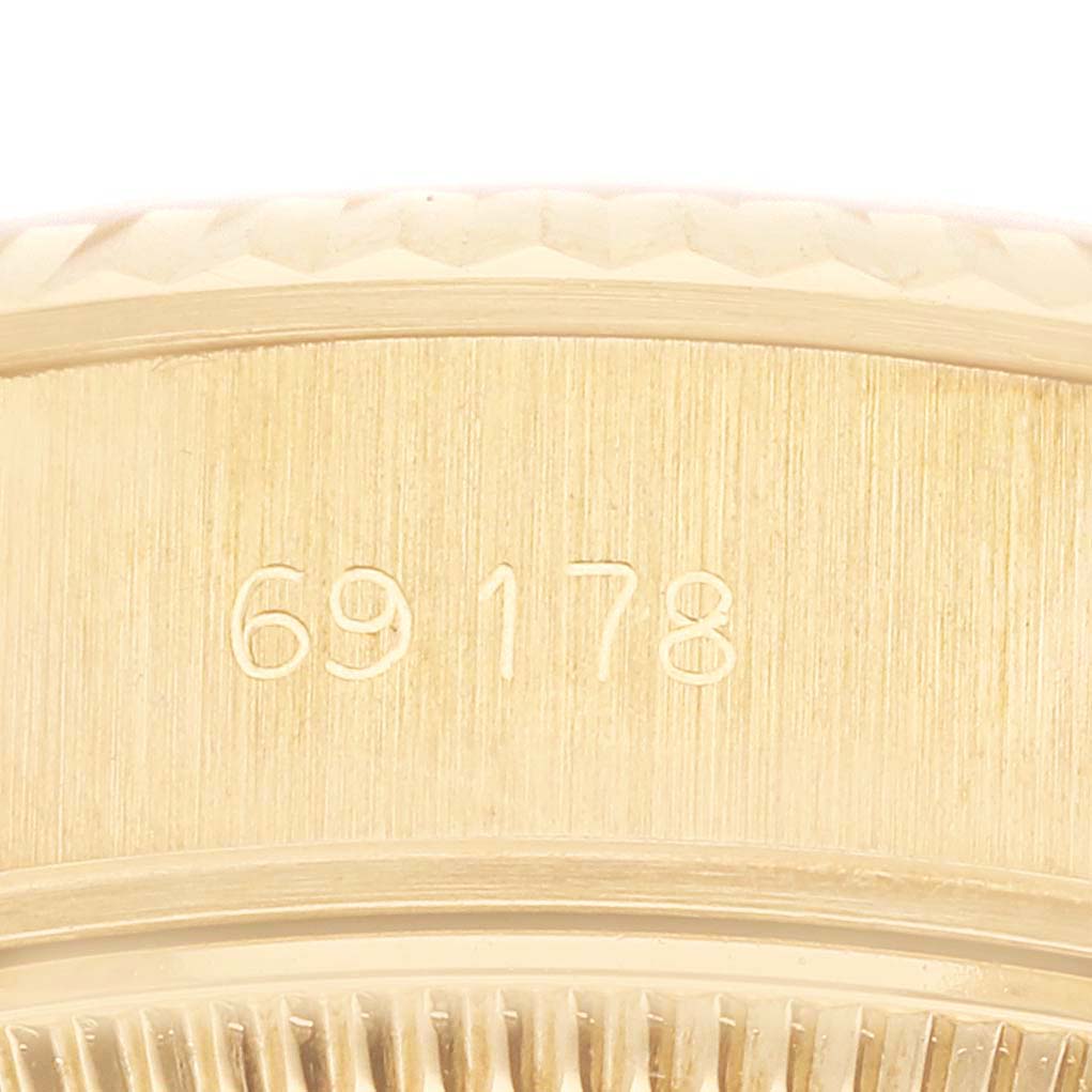 This image shows a close-up of the case back of a Rolex President 69178 Women's Yellow Gold Champagne Dial 69178 Women's Yellow Gold Champagne Dial model watch, featuring its engraved model number.