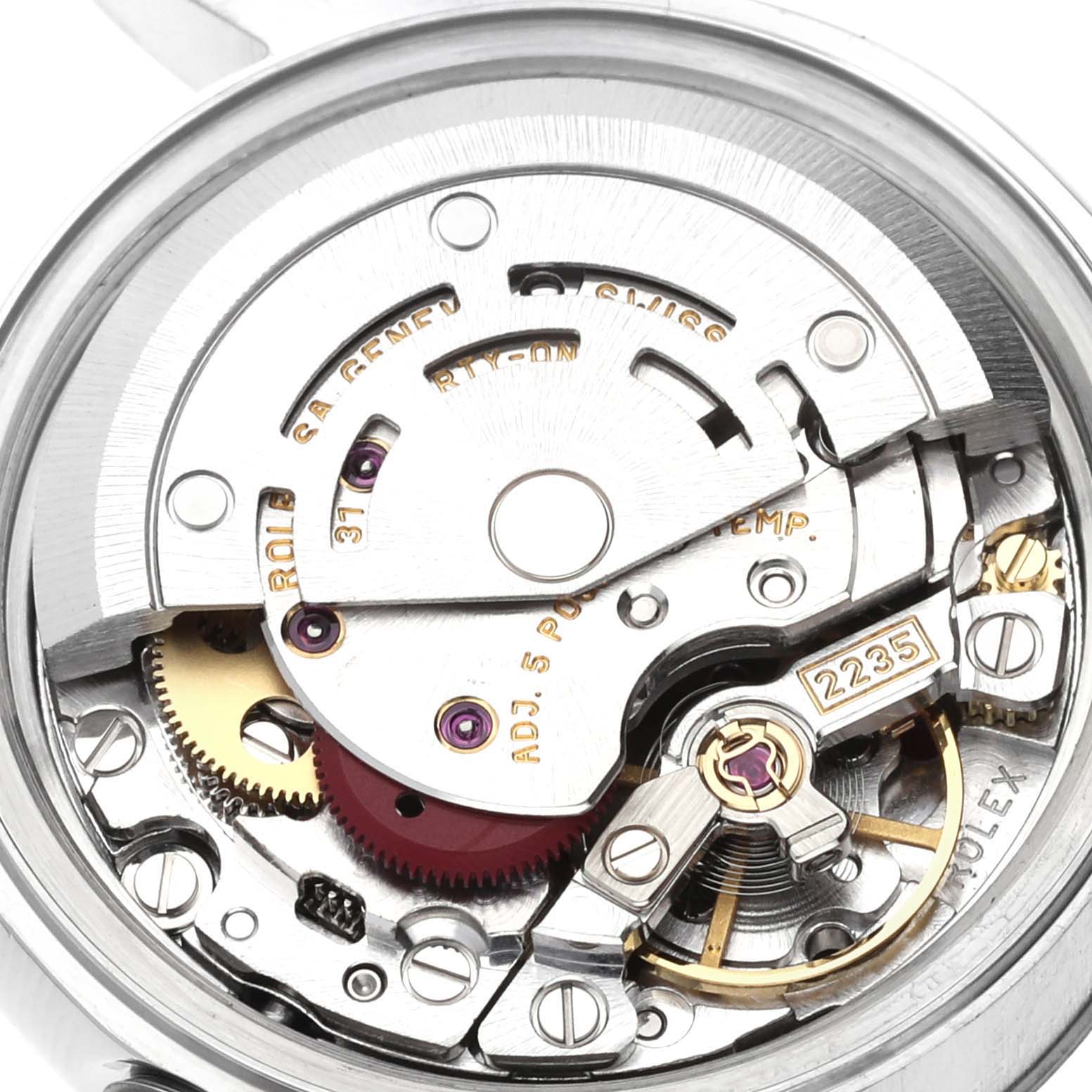 The image shows a close-up of the internal mechanism of a Rolex Datejust 79174 Women's Stainless Steel Pink Dial 79174 Women's Stainless Steel Pink Dial watch, specifically the movement and gears.