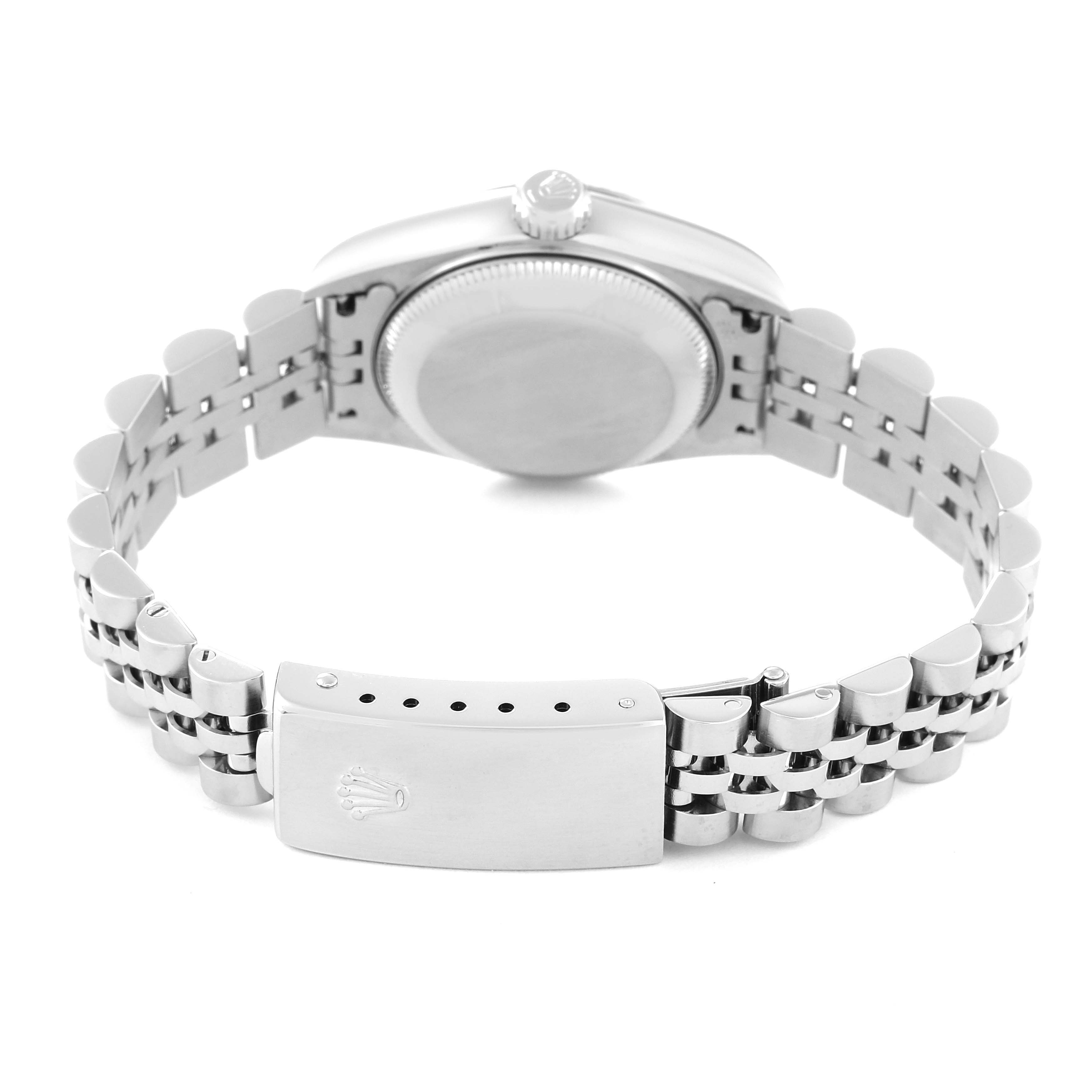 This image shows the back of a Rolex Datejust 79174 Women's Stainless Steel Pink Dial 79174 Women's Stainless Steel Pink Dial watch, highlighting the case back, bracelet, and clasp with the Rolex crown logo.