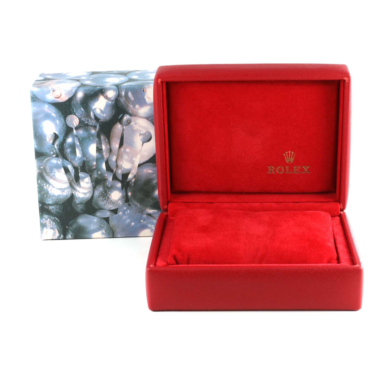 The image shows an open red Rolex watch box with the lid displaying the Rolex logo, alongside a decorative outer box.