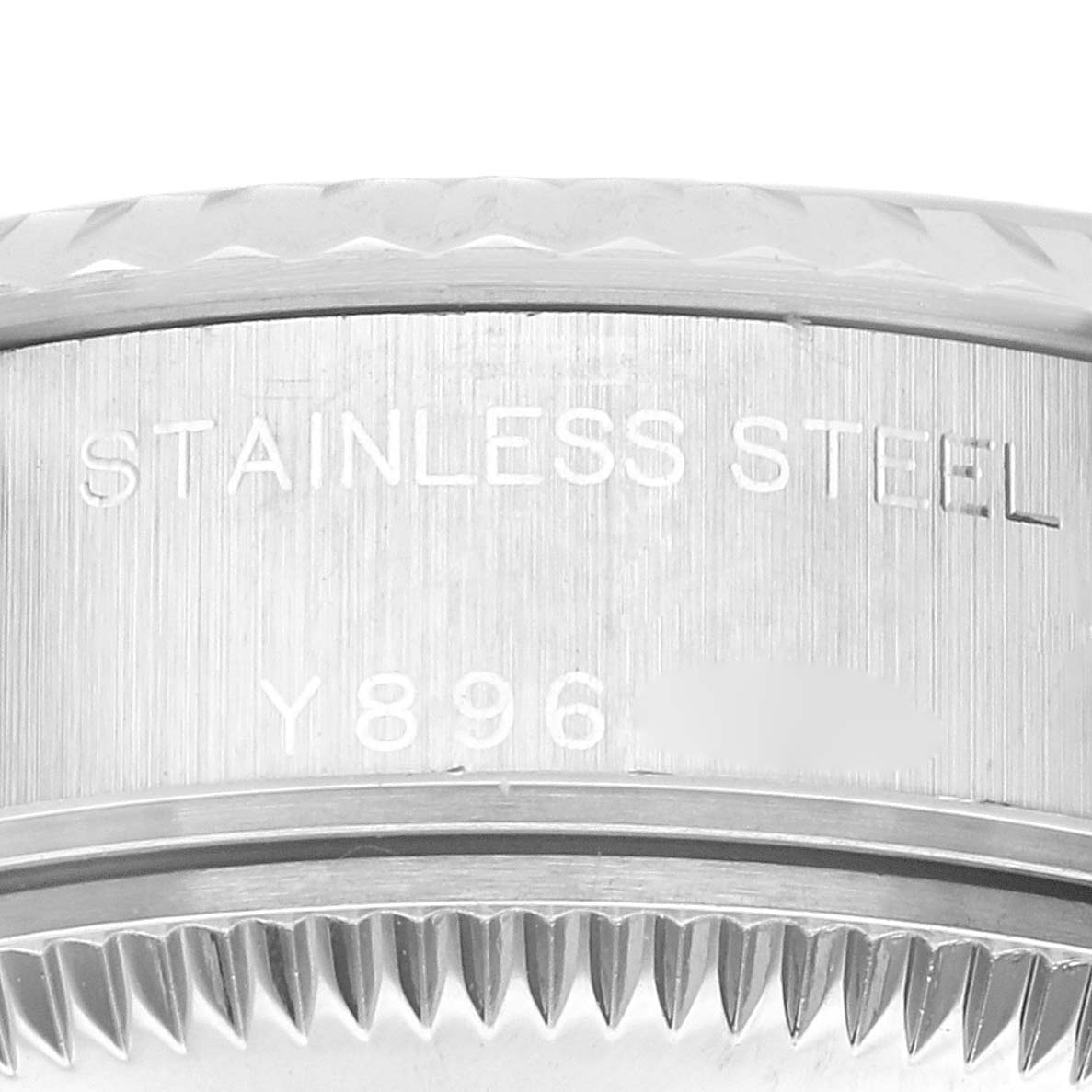 A close-up of the Rolex Datejust 79174 Women's Stainless Steel Pink Dial 79174 Women's Stainless Steel Pink Dial watch shows the side of the case, highlighting its stainless steel composition and part of its reference number.