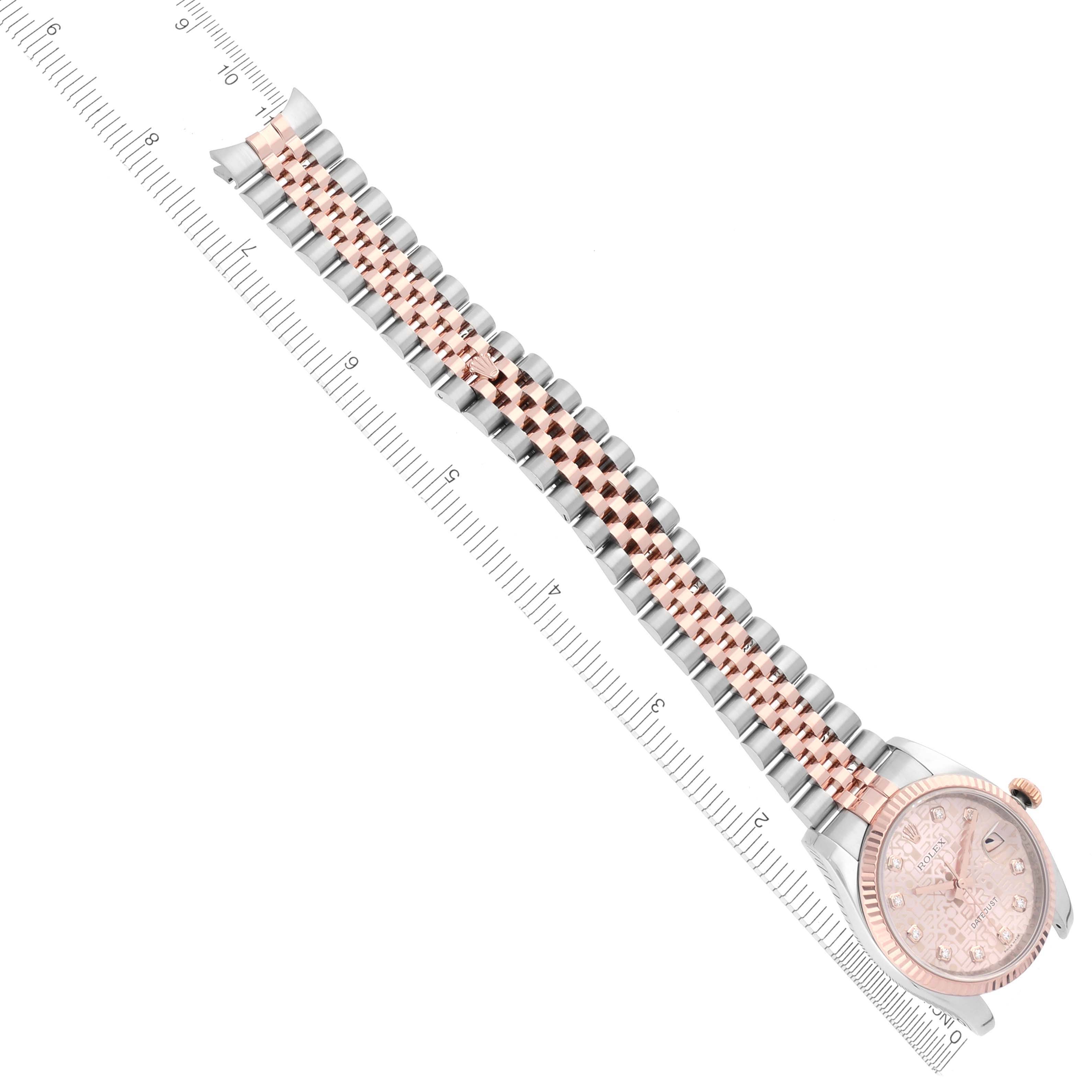 The image shows a Rolex Datejust 116231 Men's Steel and Gold (two tone) Pink Dial 116231 Men's Steel and Gold (two tone) Pink Dial watch from a top angle, displaying its bracelet and part of the dial, alongside a ruler for measurement.