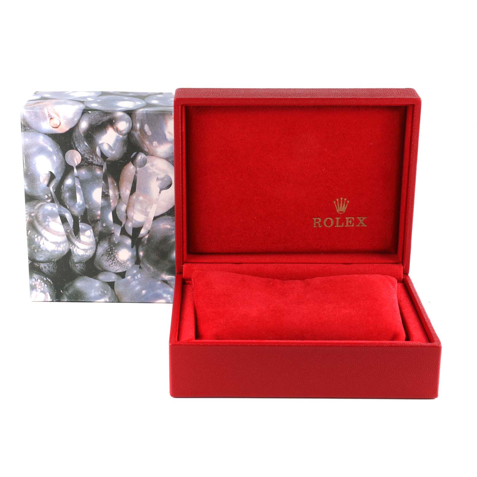 The image shows an open red Rolex watch box, presumably for the Datejust model, with branded packaging in the background.