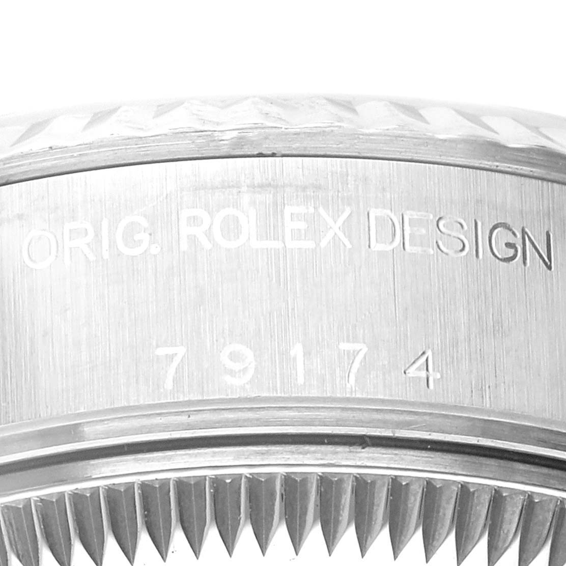 Close-up of the side profile of a Rolex Datejust 79174 Women's Stainless Steel Black Dial 79174 Women's Stainless Steel Black Dial watch case with the model number engraved.