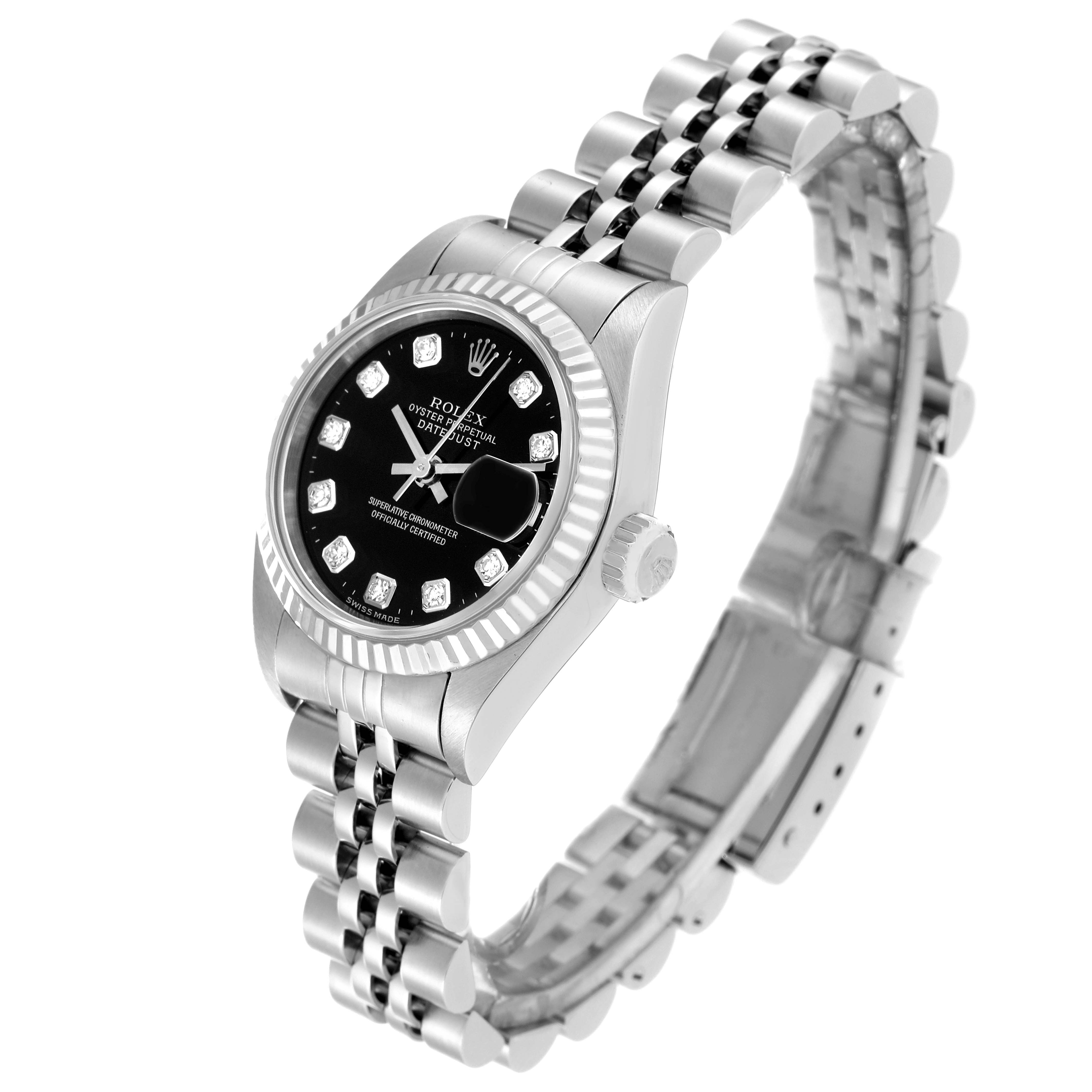 The image shows a Rolex Datejust 79174 Women's Stainless Steel Black Dial 79174 Women's Stainless Steel Black Dial watch angled to display its black dial, fluted bezel, crown, and Jubilee bracelet.