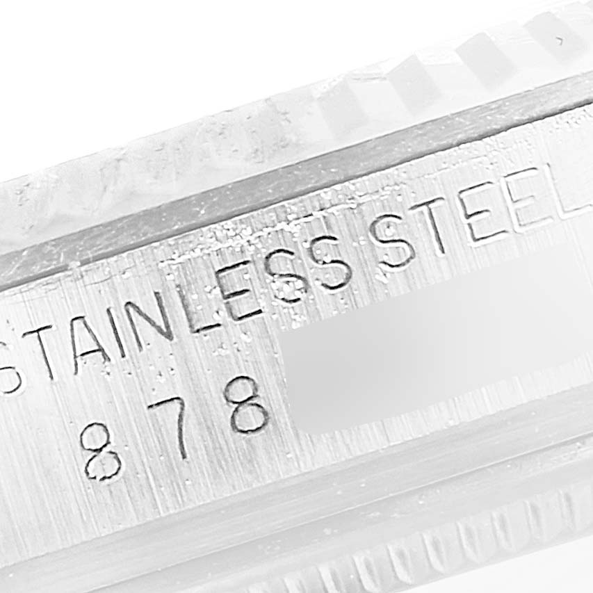 This close-up image shows the stainless steel case with engraving on a Rolex Vintage Collection 16014 Men
s Stainless Steel Silver Dial 16014 Men
s Stainless Steel Silver Dial model.