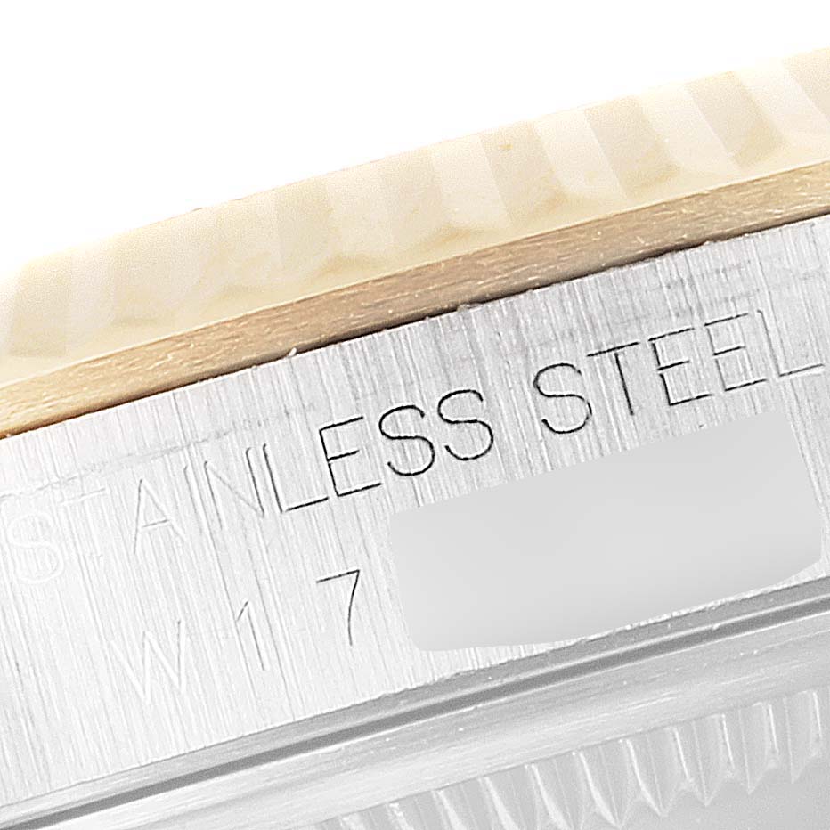 This close-up image shows the side view of a Rolex Datejust 16233 Men's Steel and Gold (two tone) Blue Dial 16233 Men's Steel and Gold (two tone) Blue Dial watch, highlighting the stainless steel and engravings.