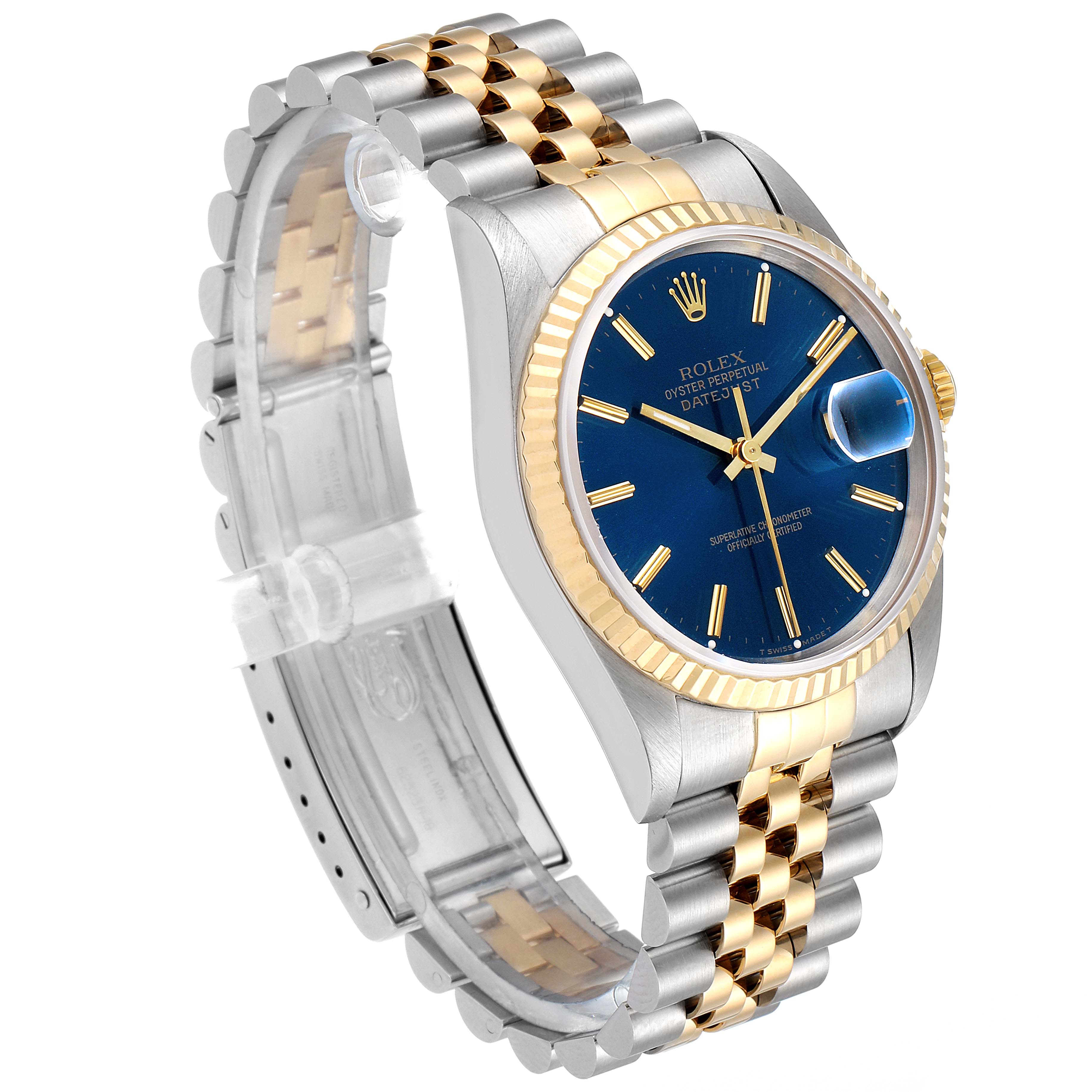 The image shows a Rolex Datejust 16233 Men's Steel and Gold (two tone) Blue Dial 16233 Men's Steel and Gold (two tone) Blue Dial watch at a three-quarters angle, highlighting its blue dial, fluted bezel, and two-tone bracelet.