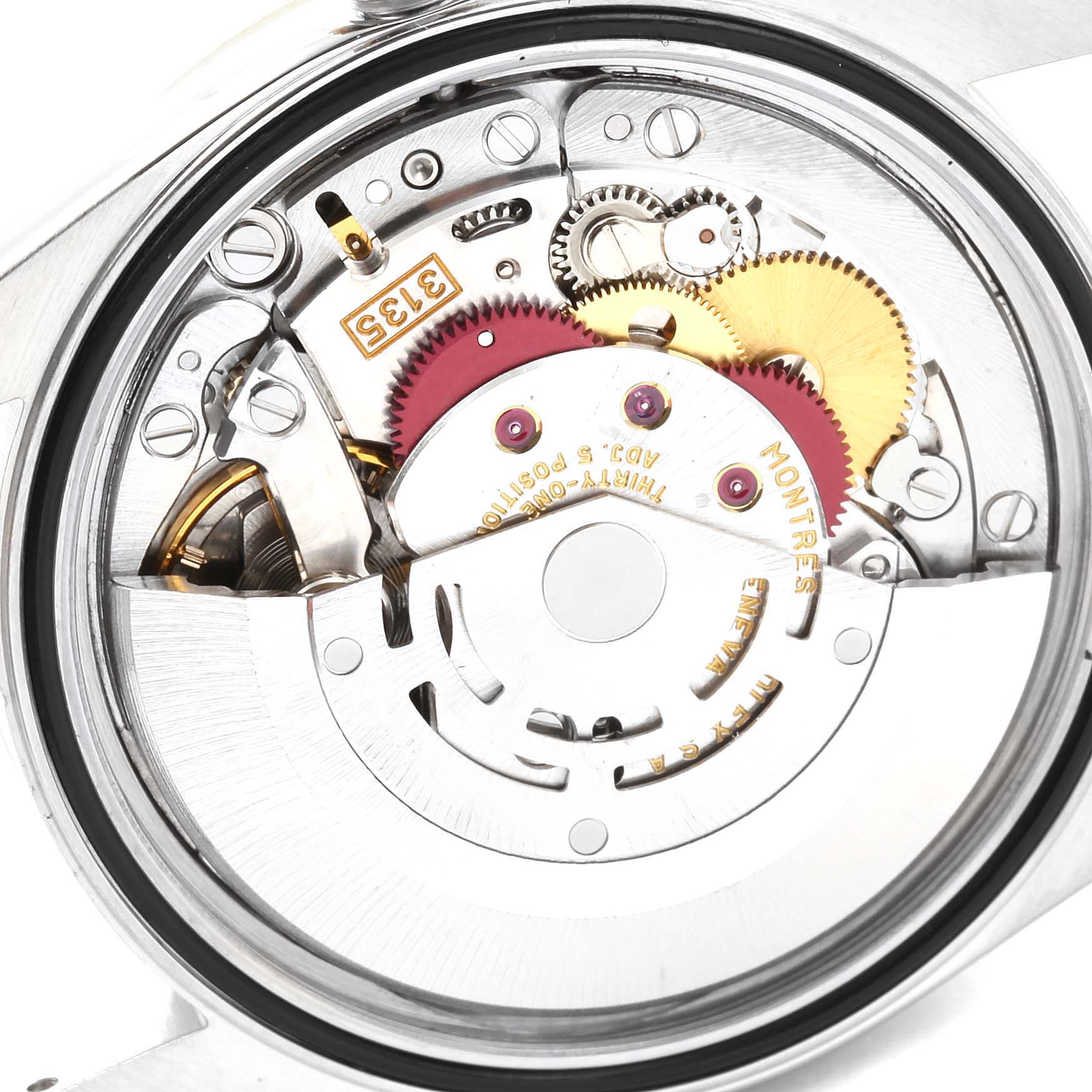 This is a close-up view of the internal mechanism of a Rolex Datejust 16233 Men's Steel and Gold (two tone) Champagne Dial 16233 Men's Steel and Gold (two tone) Champagne Dial watch, showcasing its gears and movement components.