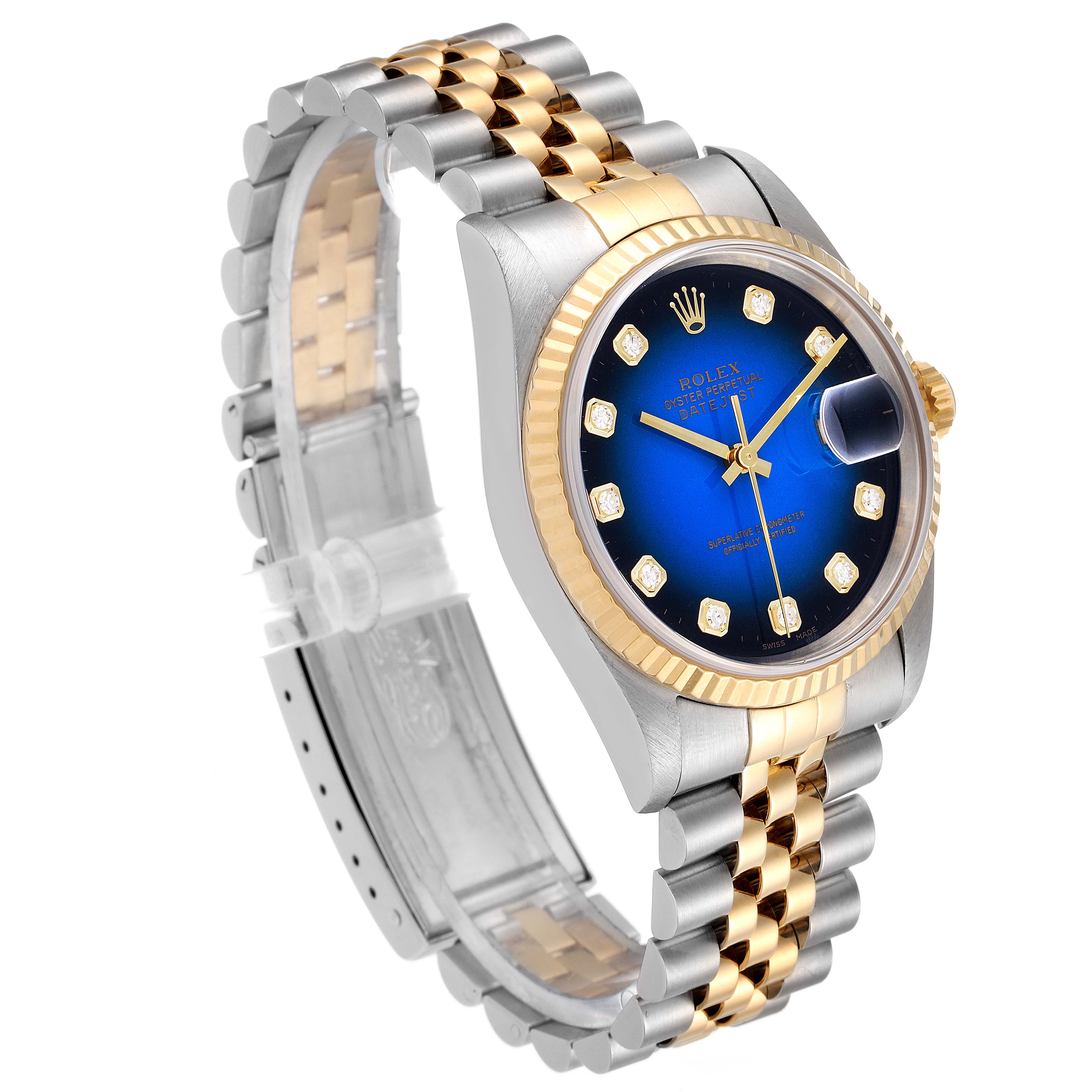 The Rolex Datejust 16233 Men's Steel and Gold (two tone) Blue Dial 16233 Men's Steel and Gold (two tone) Blue Dial watch is shown in a three-quarter view, highlighting the blue dial, gold fluted bezel, date magnifier, and two-tone bracelet.